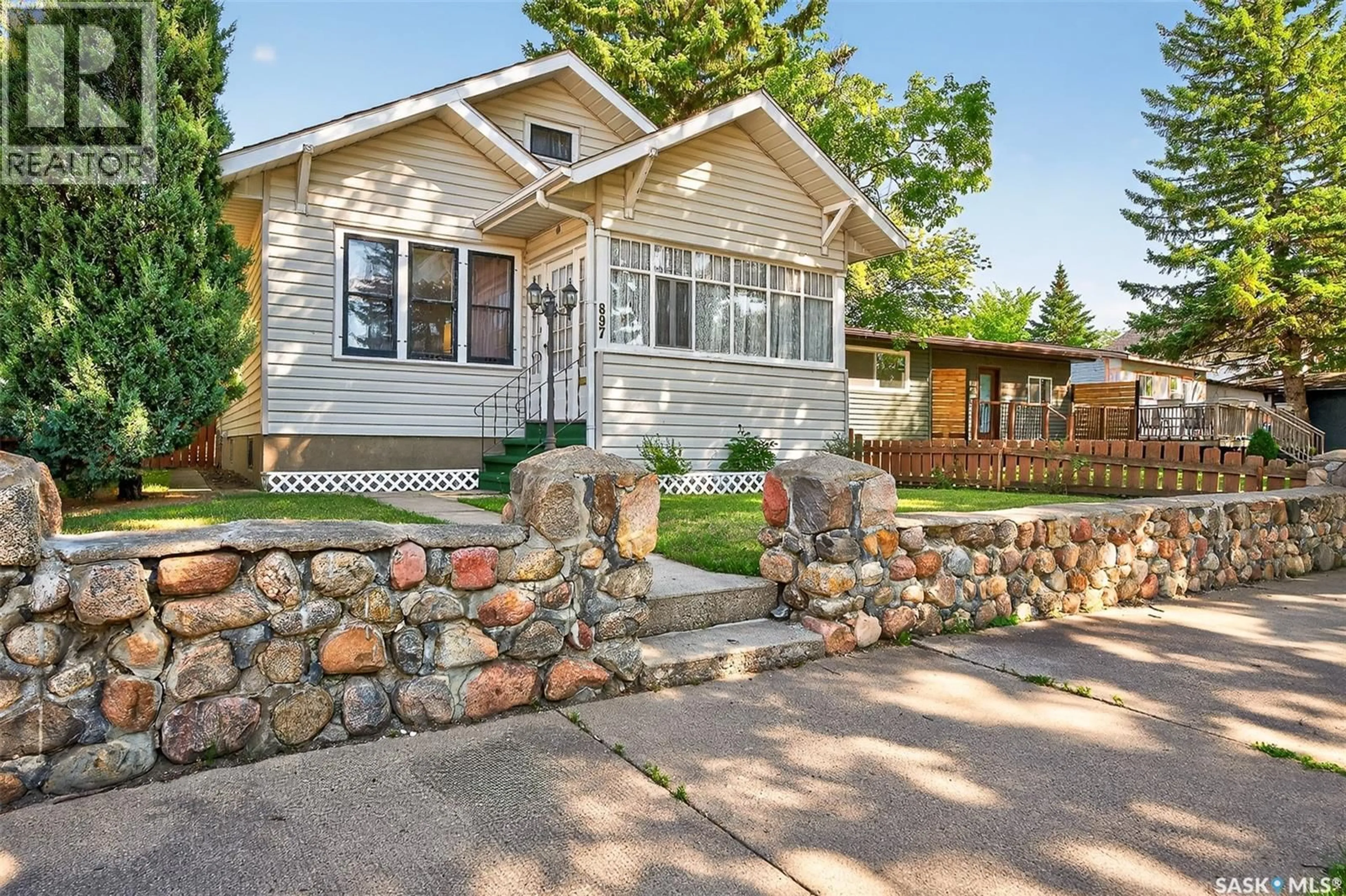 Home with vinyl exterior material, street for 897 WILLOW AVENUE, Moose Jaw Saskatchewan S6H1G4