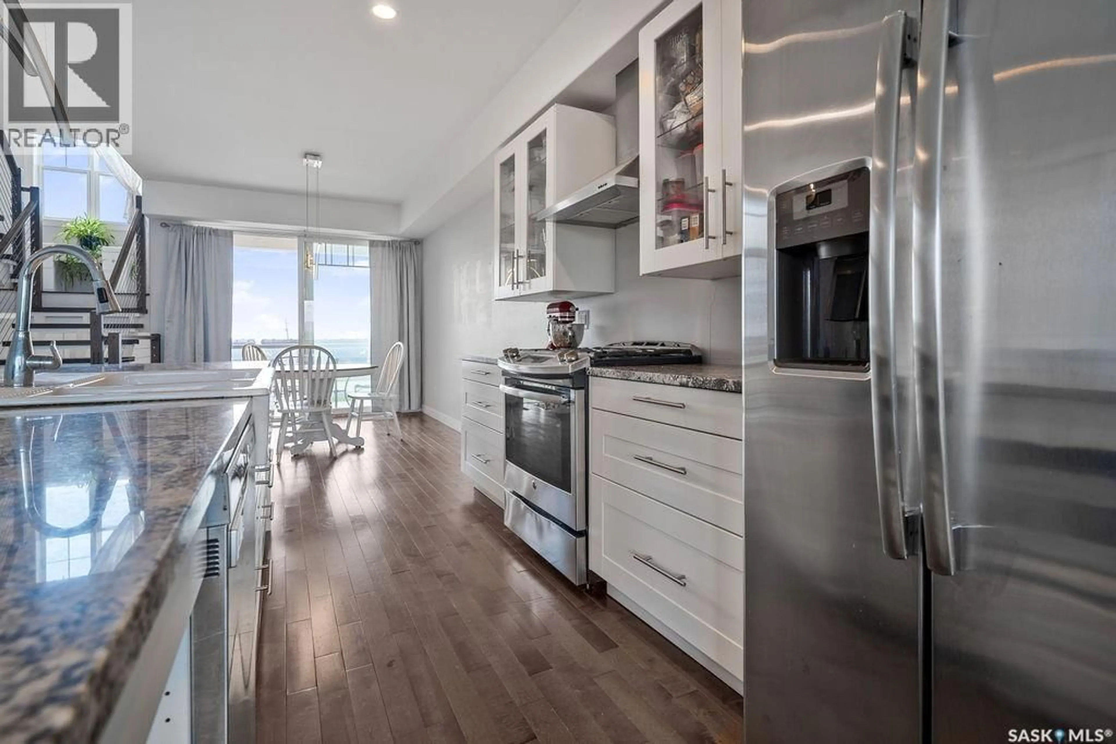 Open concept kitchen, wood/laminate floor for 709 RAILWAY AVENUE, Wilcox Saskatchewan S0G5E0