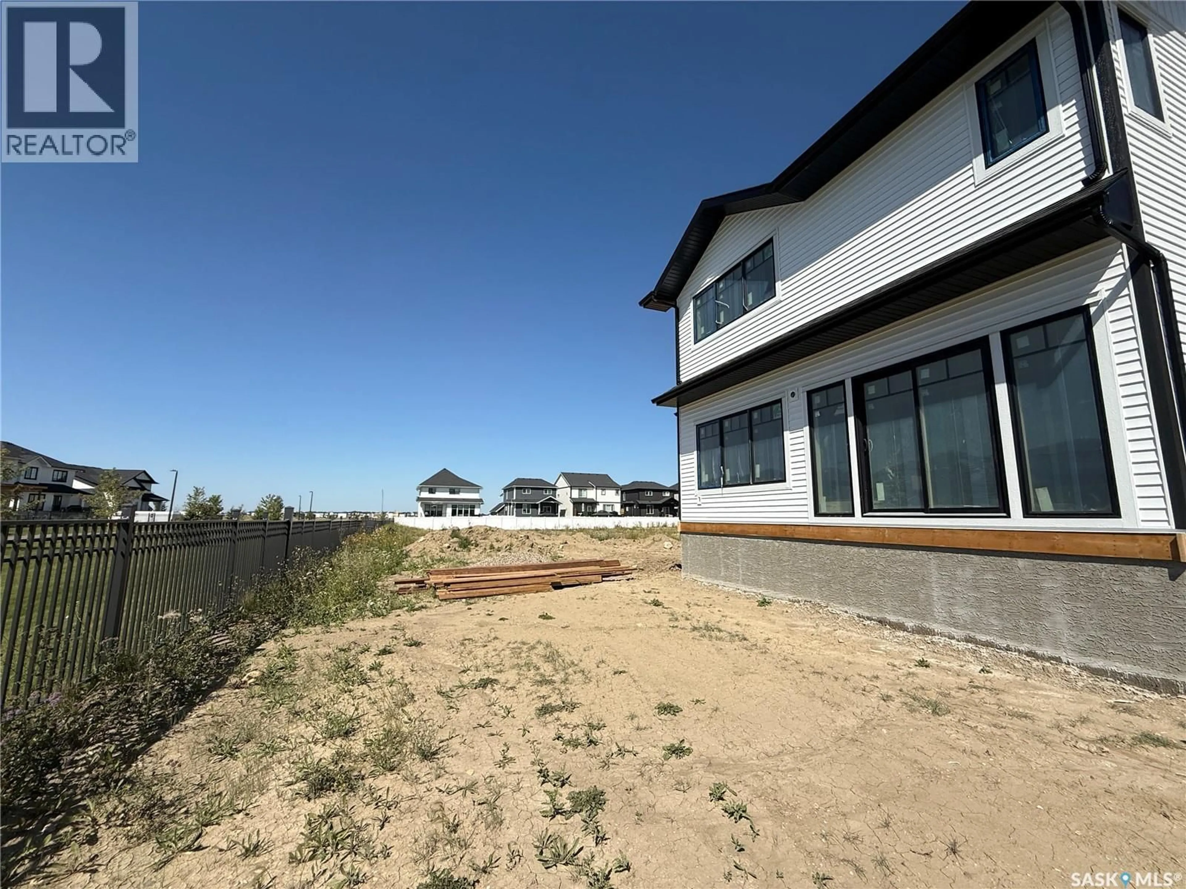 A pic from outside/outdoor area/front of a property/back of a property/a pic from drone, building for 142 HAVERSTOCK CRESCENT, Saskatoon Saskatchewan S7W1E3