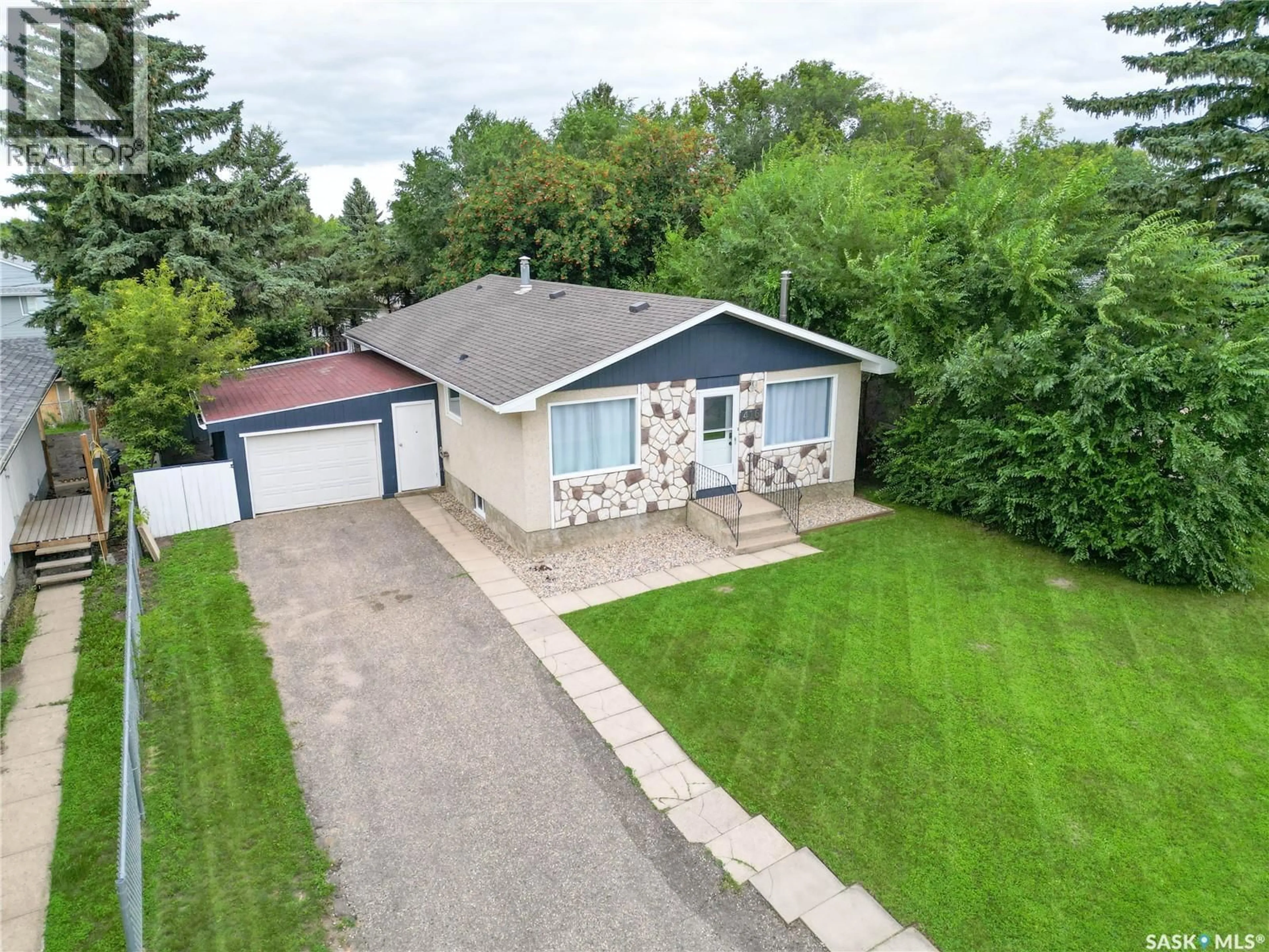 A pic from outside/outdoor area/front of a property/back of a property/a pic from drone, street for 416 30TH STREET, Prince Albert Saskatchewan S6V5V4