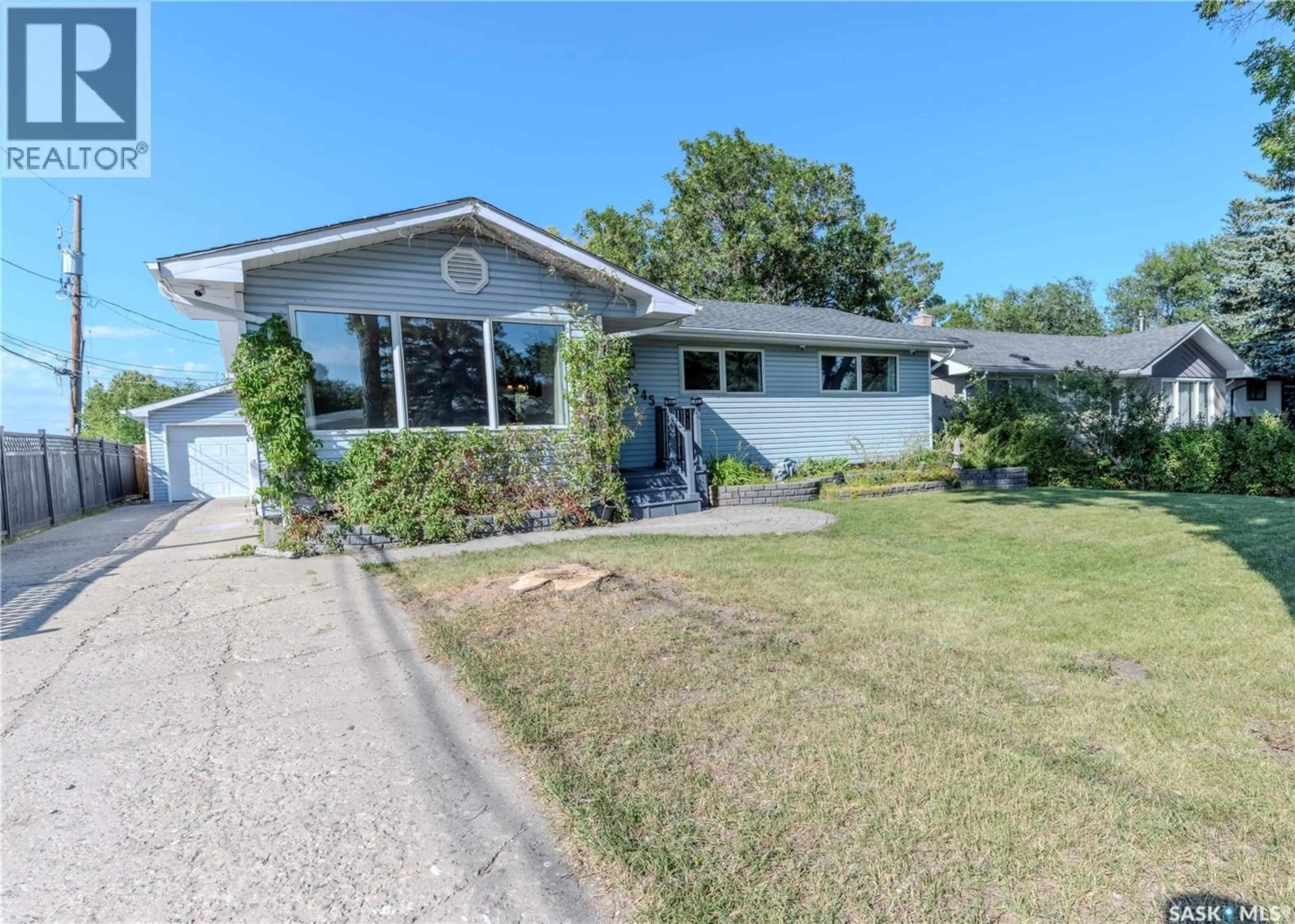 Home with vinyl exterior material, street for 3345 WASCANA STREET, Regina Saskatchewan S4S2H2