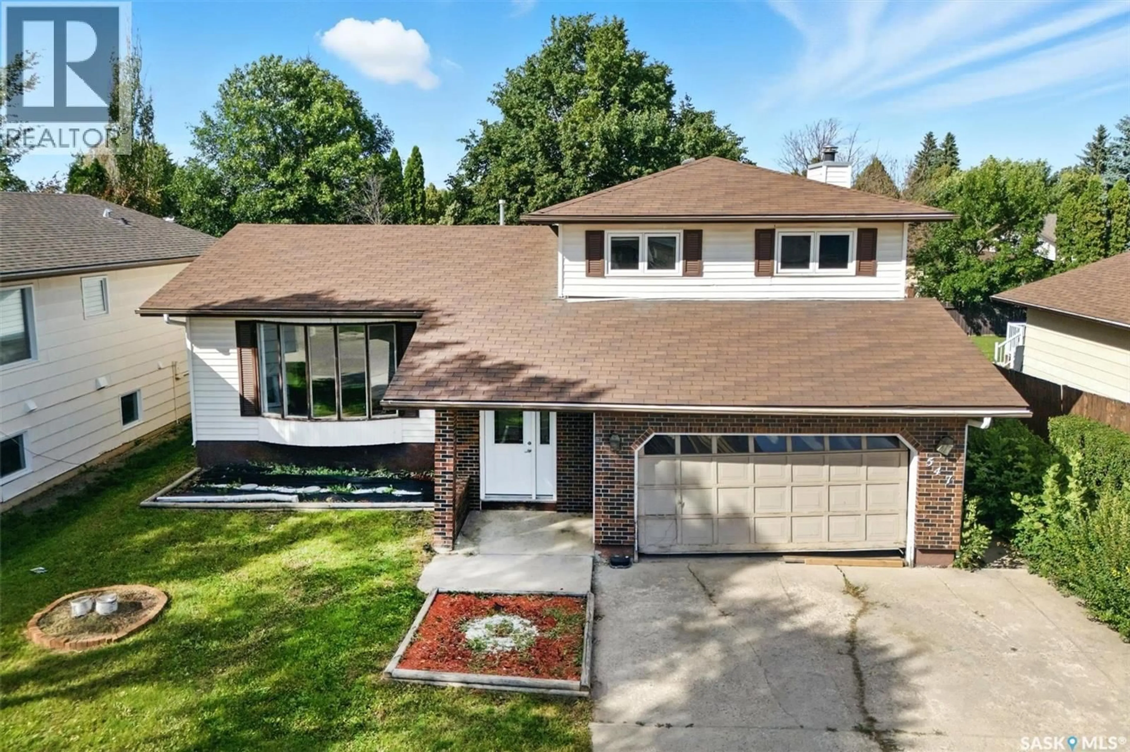 Home with vinyl exterior material, street for 547 SEBESTYEN CRESCENT, Saskatoon Saskatchewan S7K6W2
