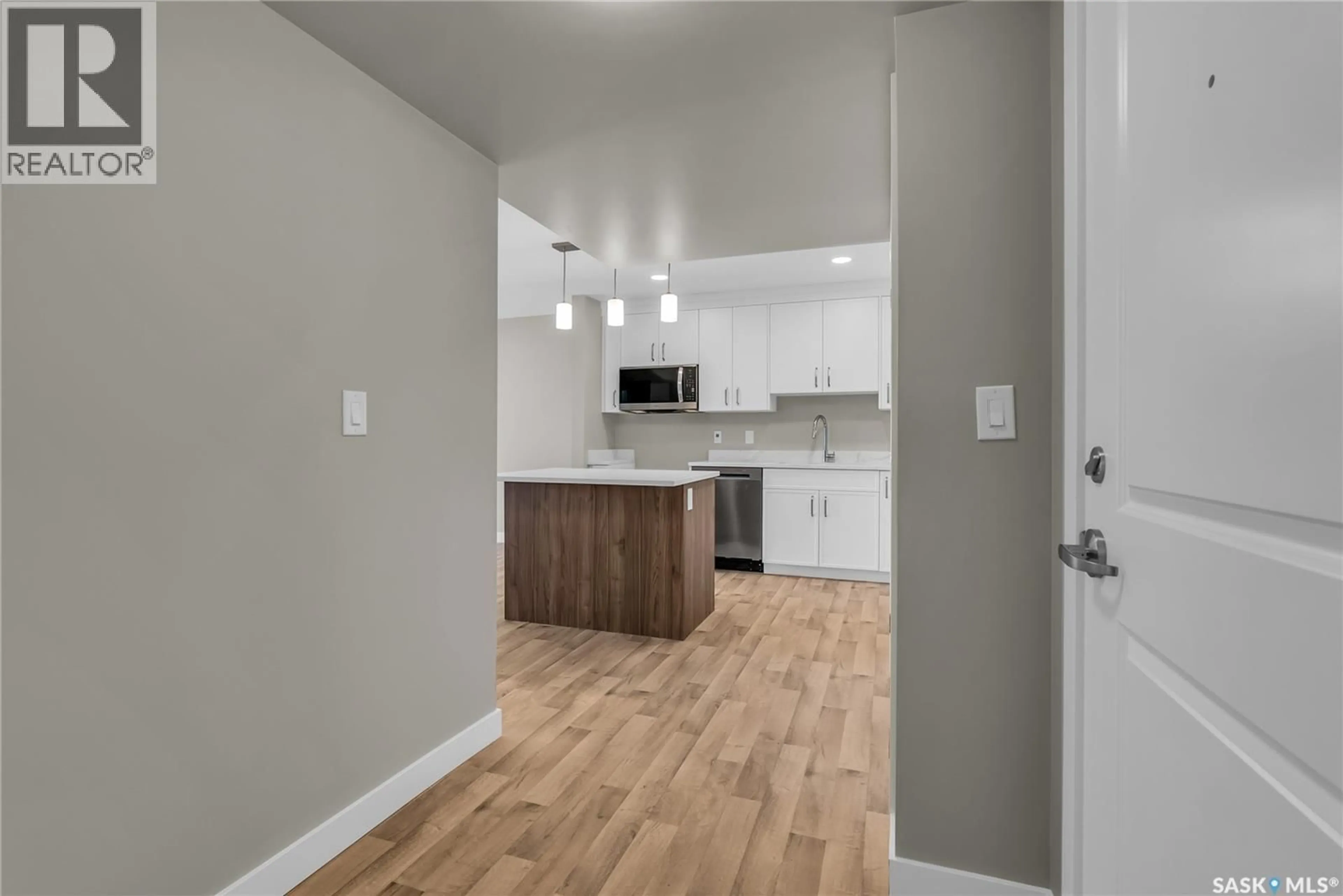 Open concept kitchen, wood/laminate floor for 105 318 108TH STREET, Saskatoon Saskatchewan S7N1P8