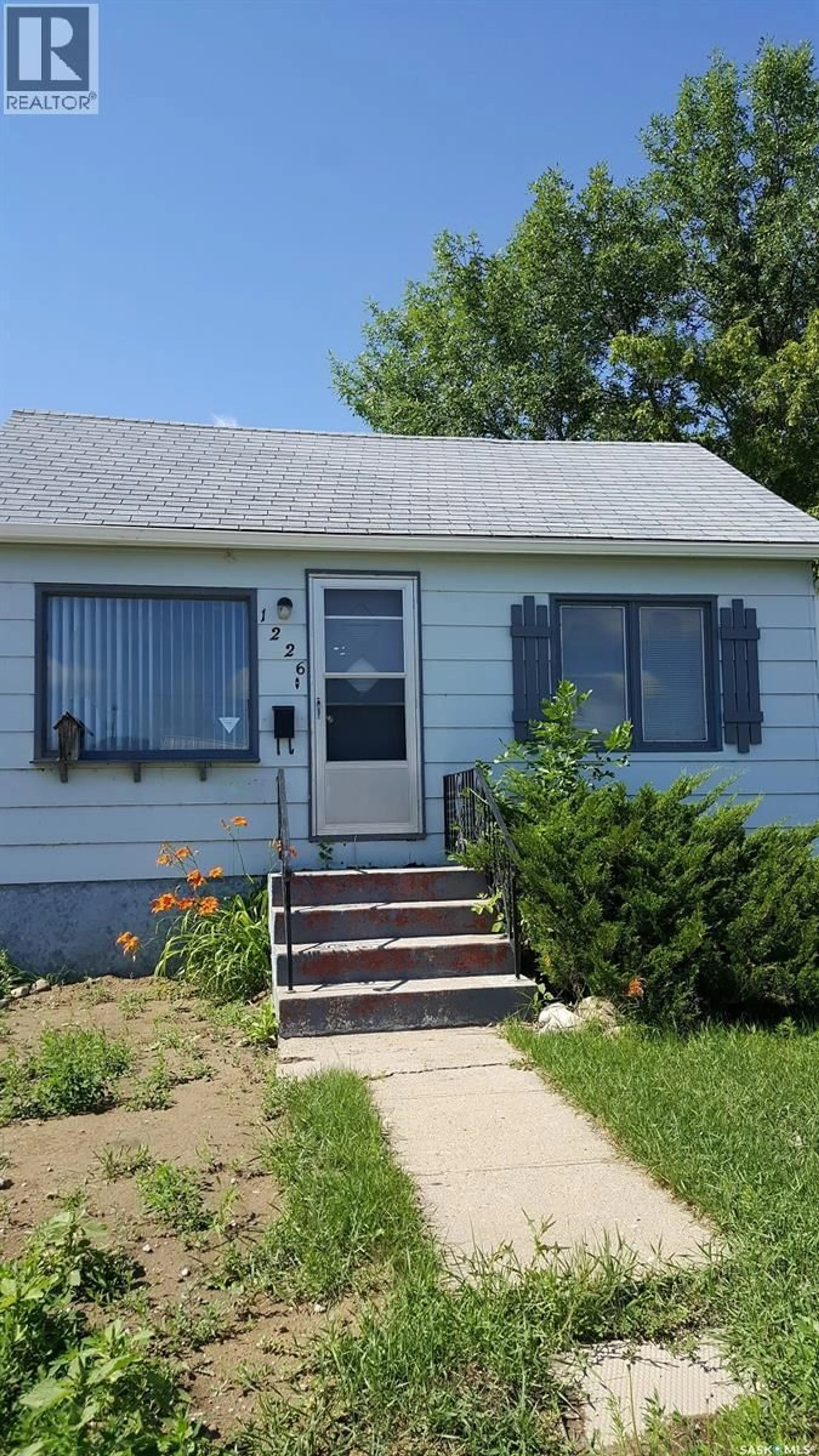 Home with vinyl exterior material, street for 1226 8TH STREET, Estevan Saskatchewan S4A1H3