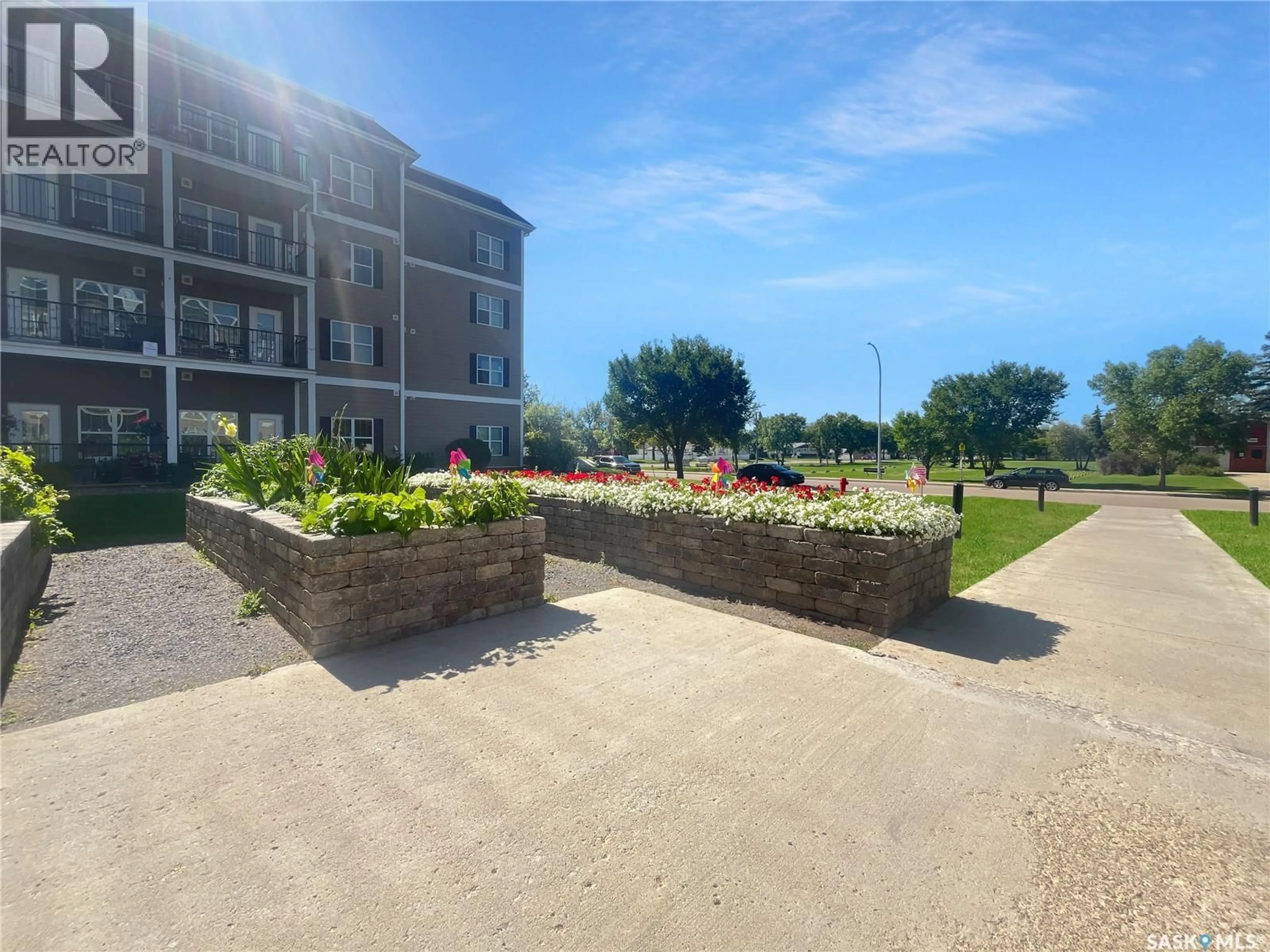 A pic from outside/outdoor area/front of a property/back of a property/a pic from drone, water/lake/river/ocean view for 318 1802 106TH STREET, North Battleford Saskatchewan S9A1J1