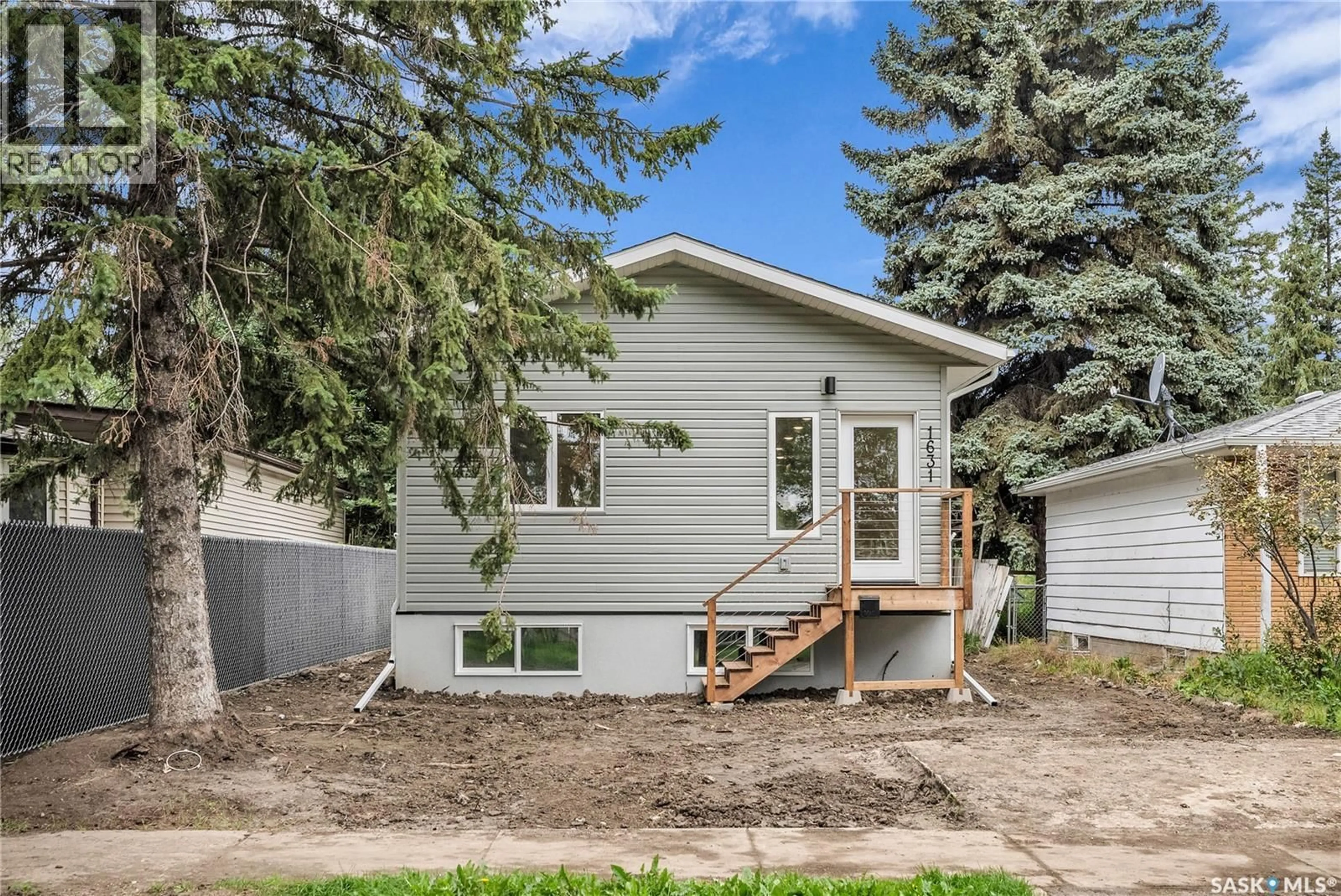 Home with vinyl exterior material, street for 1631 C AVENUE, Saskatoon Saskatchewan S7L1L4