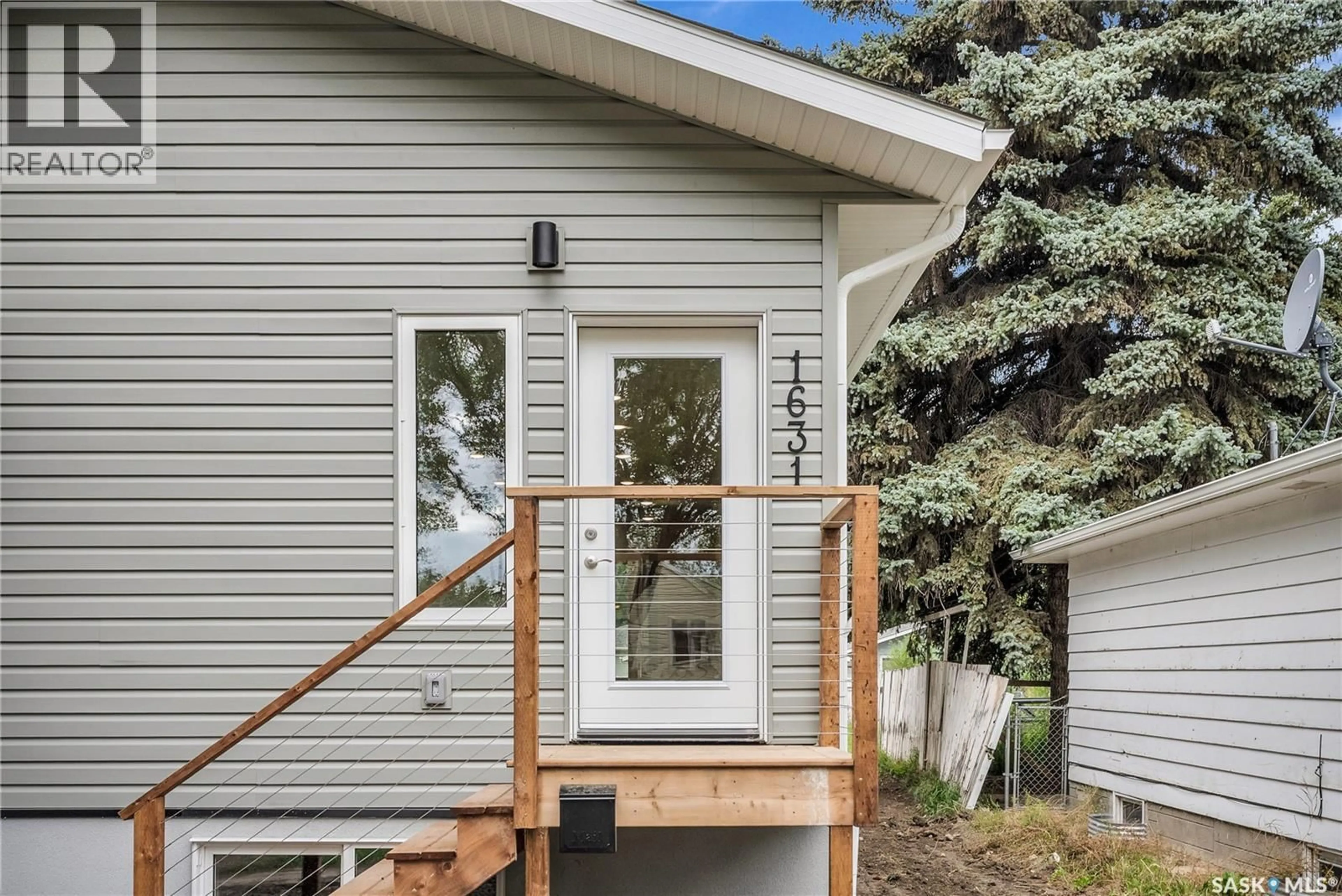 Home with vinyl exterior material, street for 1631 C AVENUE, Saskatoon Saskatchewan S7L1L4