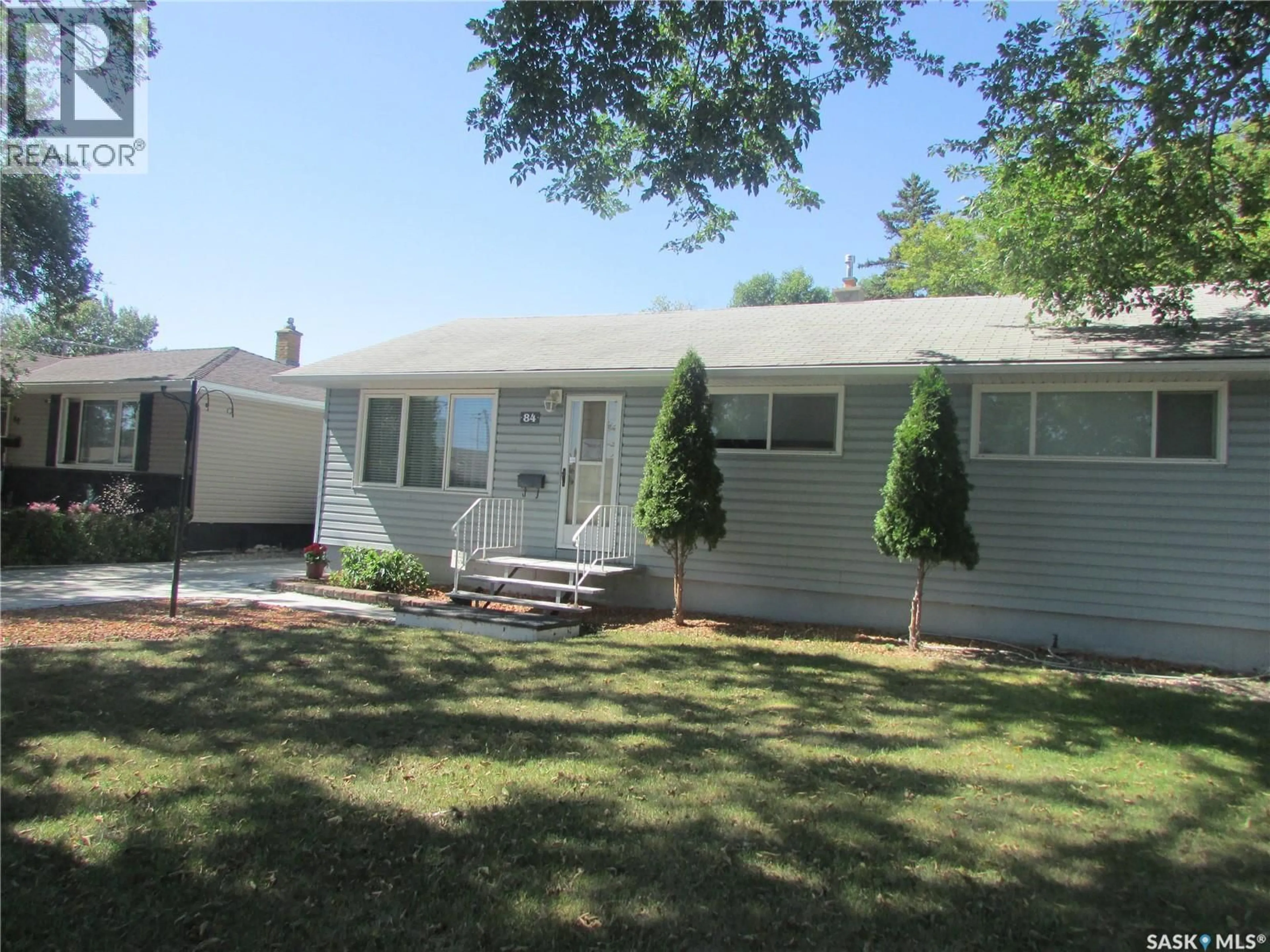Home with vinyl exterior material, street for 84 COLDWELL ROAD, Regina Saskatchewan S4R4K5