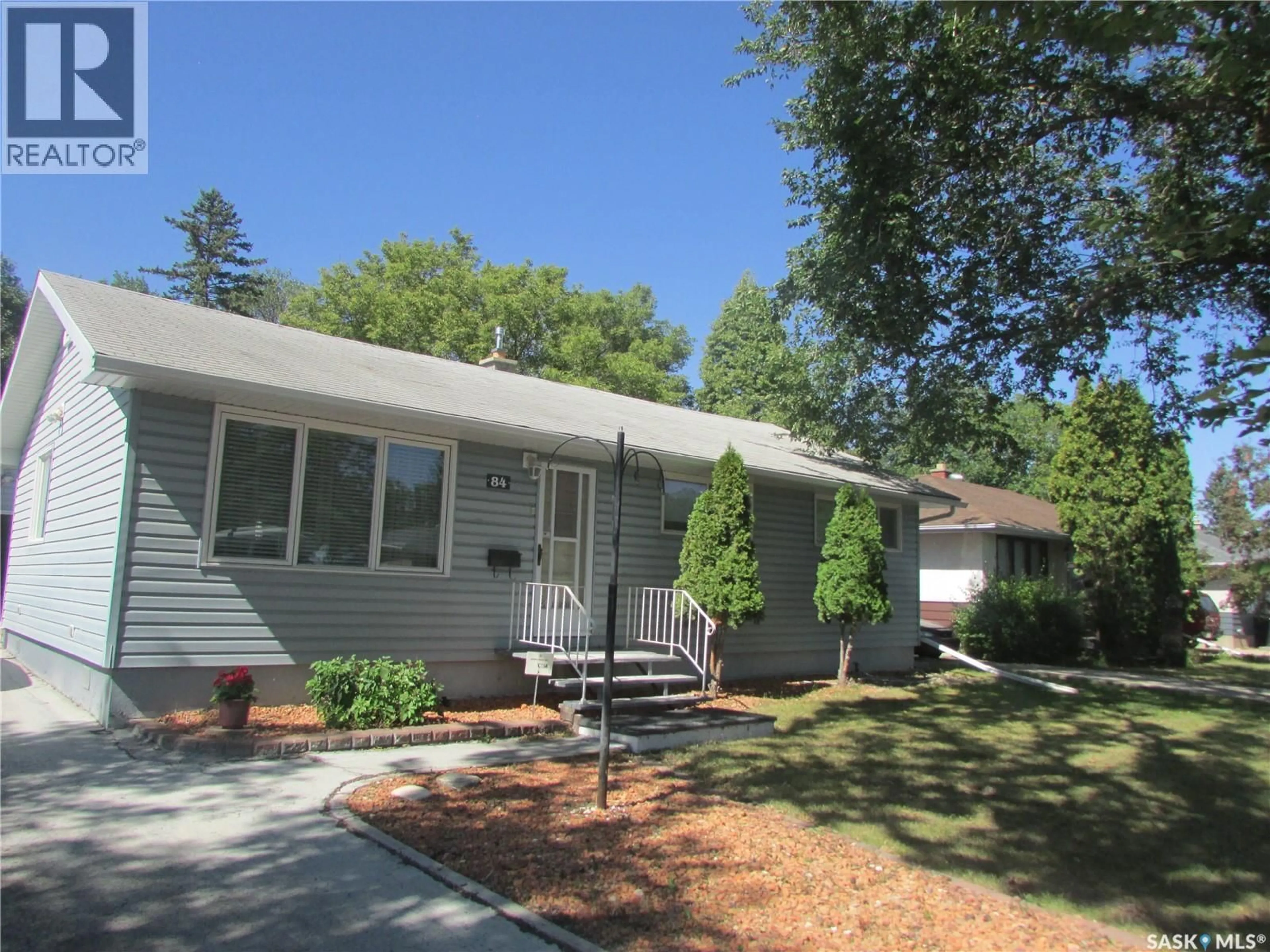 Home with vinyl exterior material, street for 84 COLDWELL ROAD, Regina Saskatchewan S4R4K5
