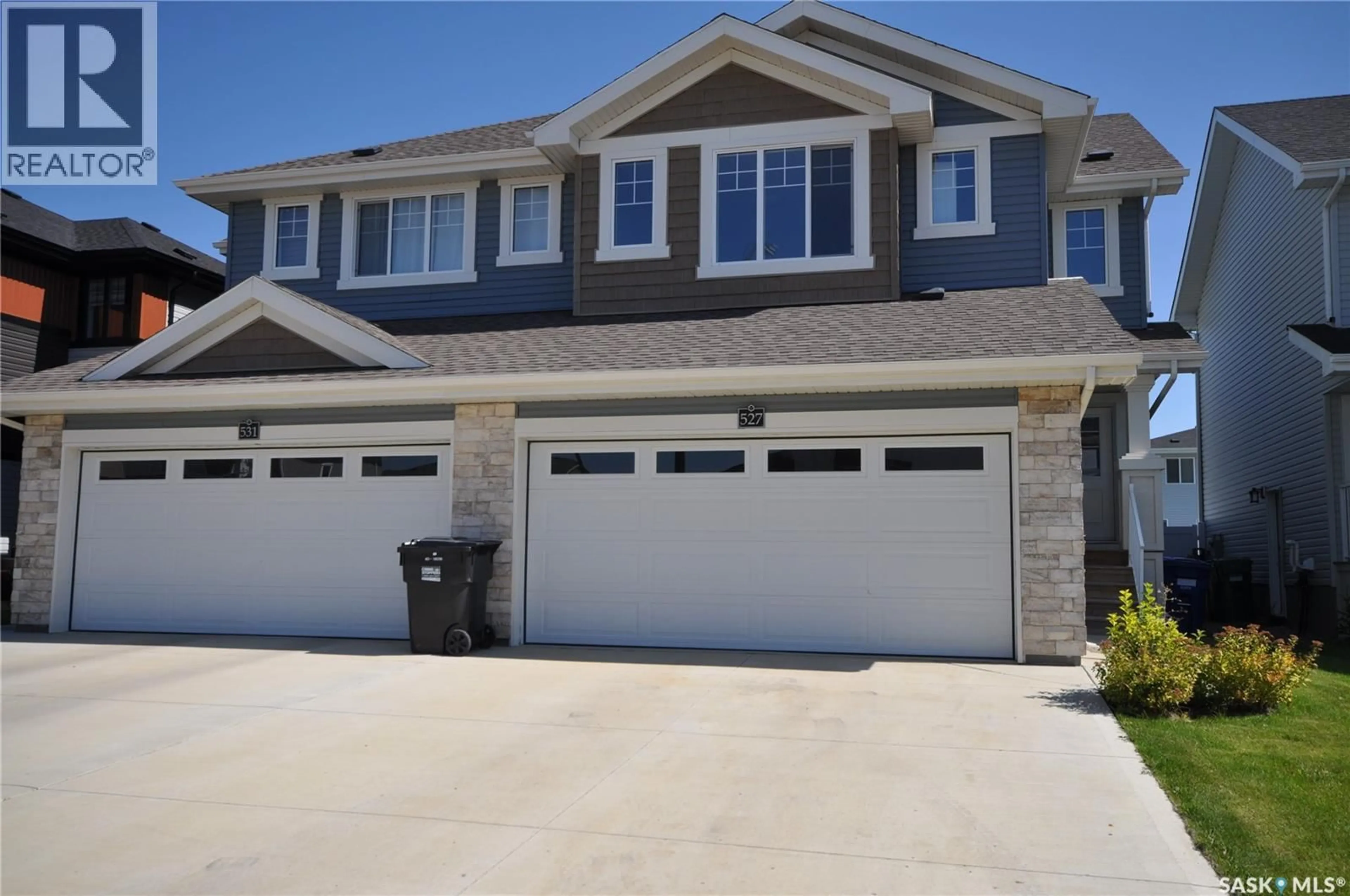 Home with vinyl exterior material, street for 527 SCHMEISER AVENUE, Saskatoon Saskatchewan S7V1P4