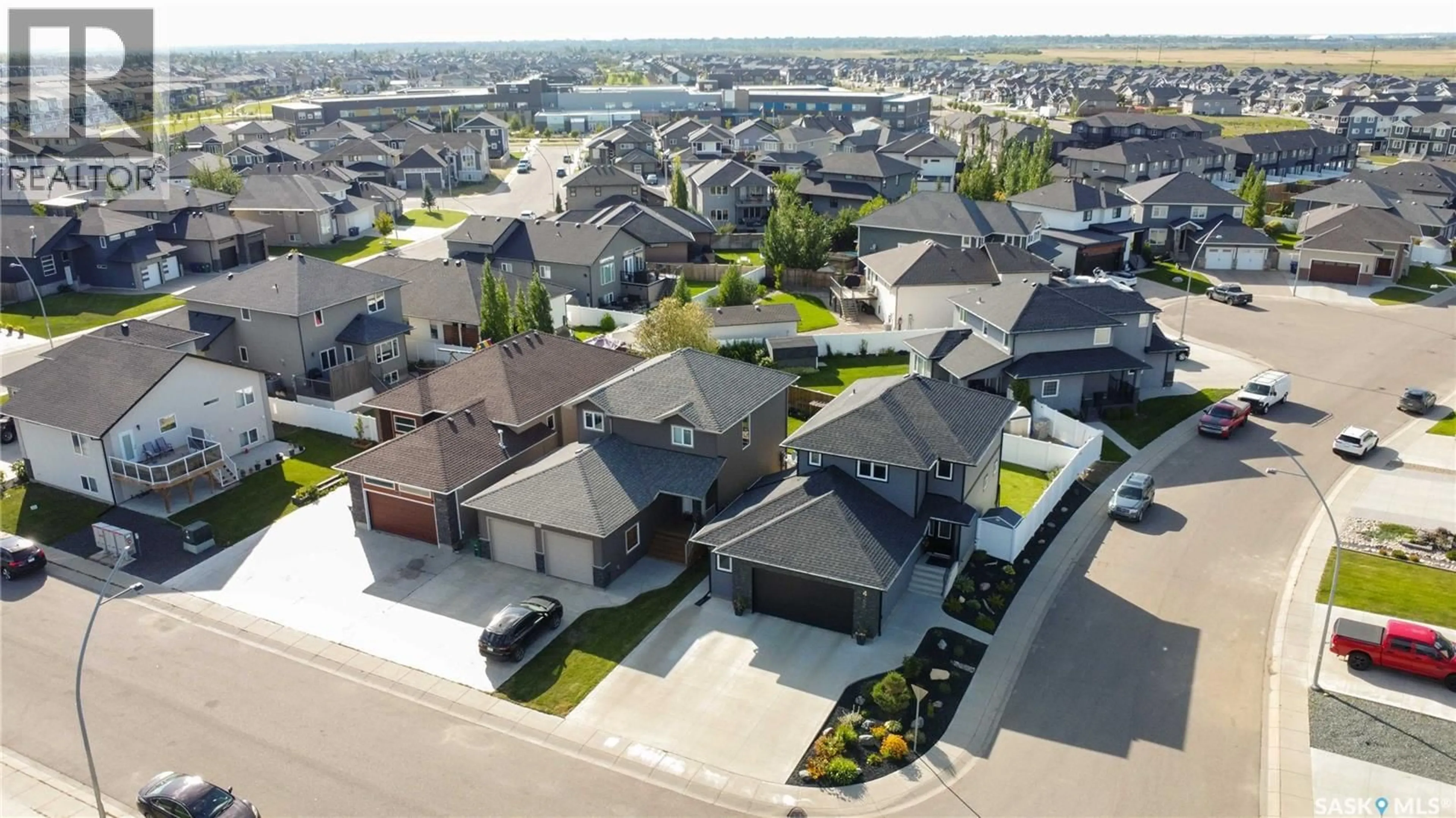 A pic from outside/outdoor area/front of a property/back of a property/a pic from drone, street for 422 GLACIAL SHORES MANOR, Saskatoon Saskatchewan S7W0R6