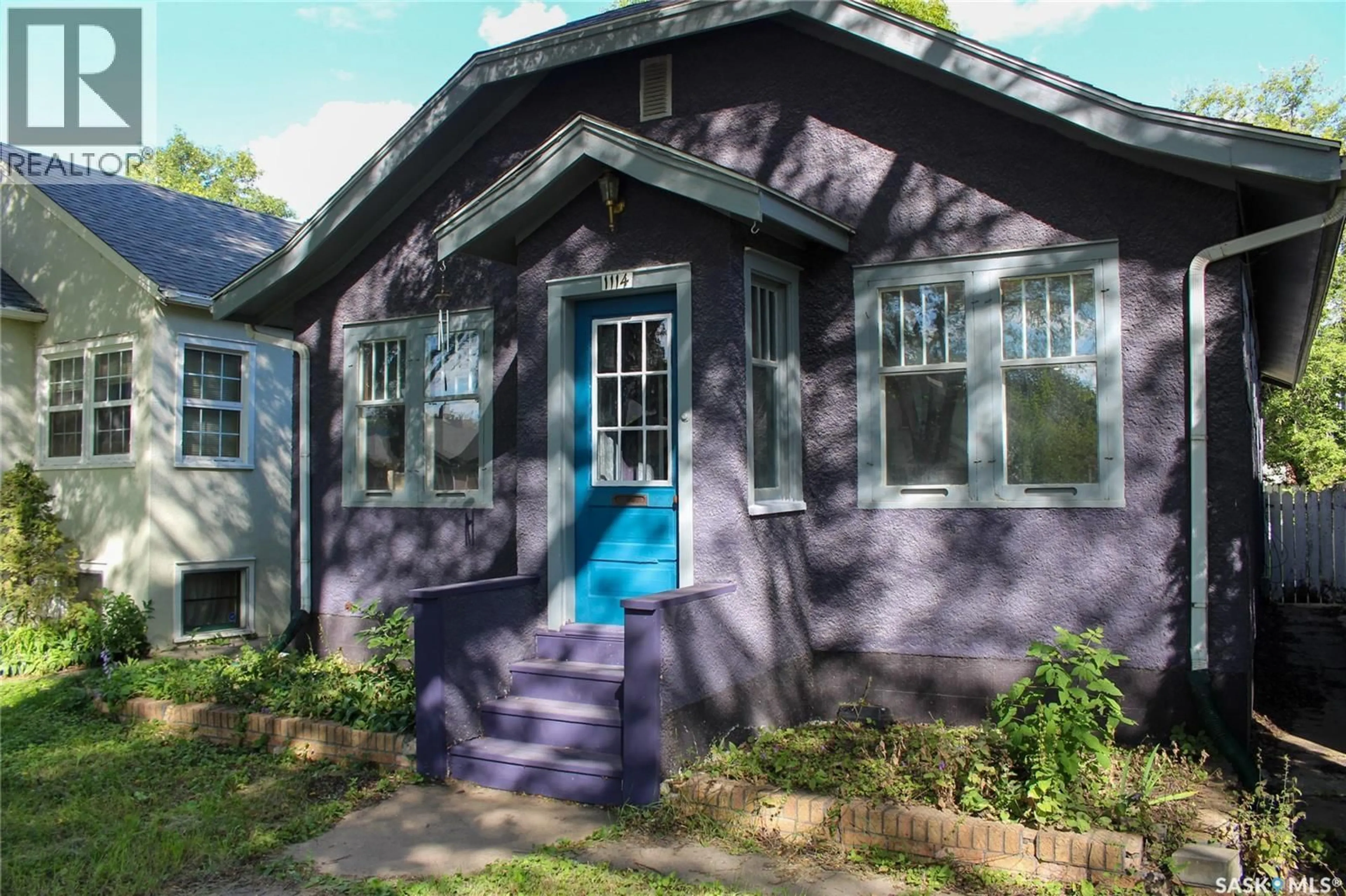 Home with vinyl exterior material, street for 1114 C AVENUE, Saskatoon Saskatchewan S7L1K4