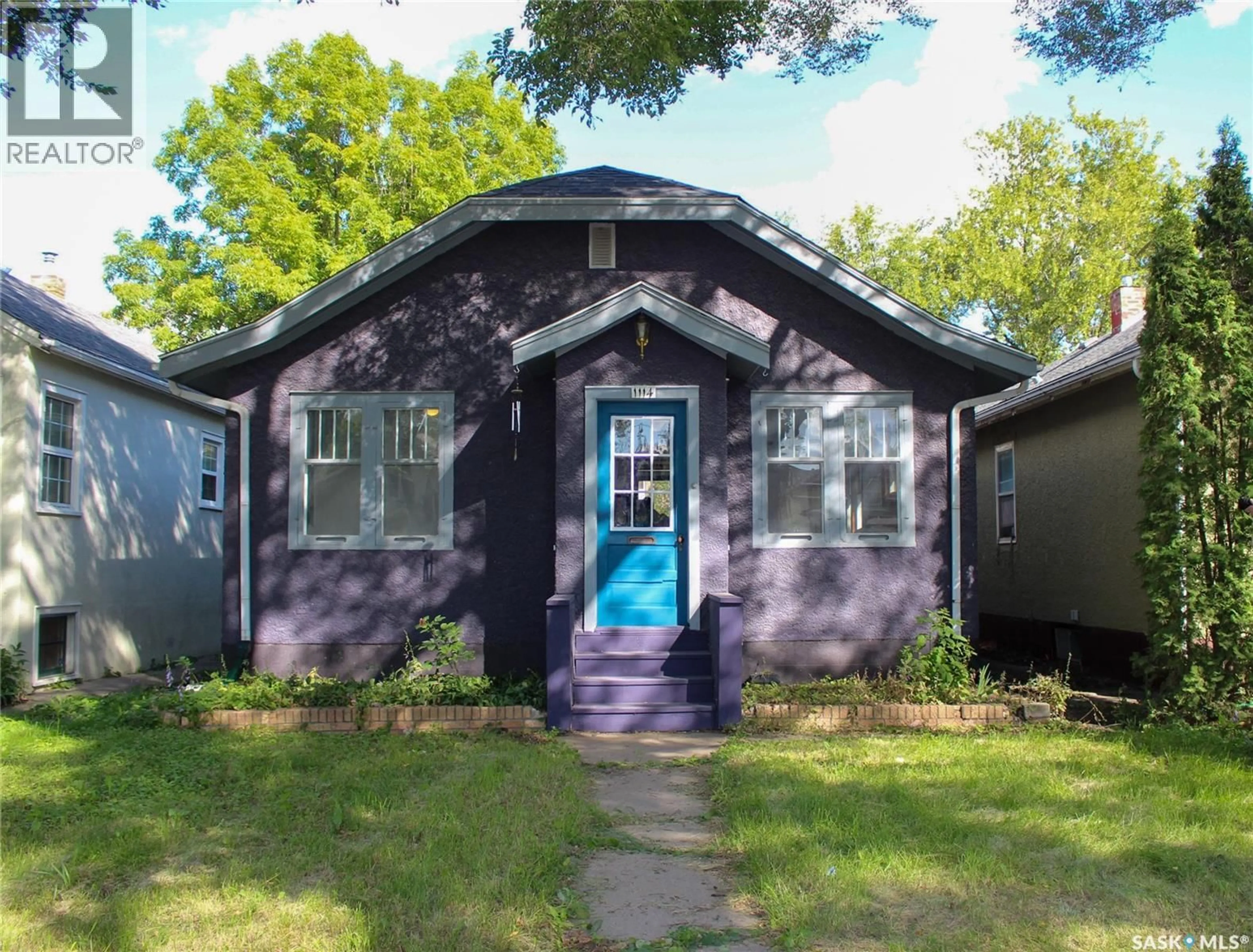 Home with vinyl exterior material, street for 1114 C AVENUE, Saskatoon Saskatchewan S7L1K4