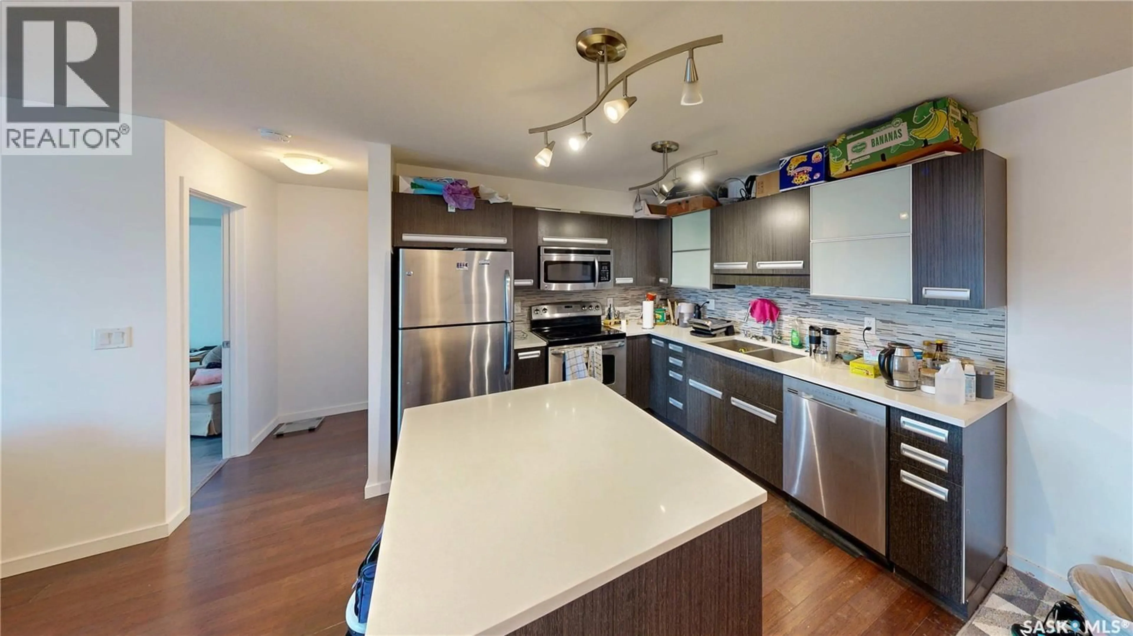 Open concept kitchen, wood/laminate floor for 305 - 1510 NEVILLE DRIVE, Regina Saskatchewan S4Z0A3