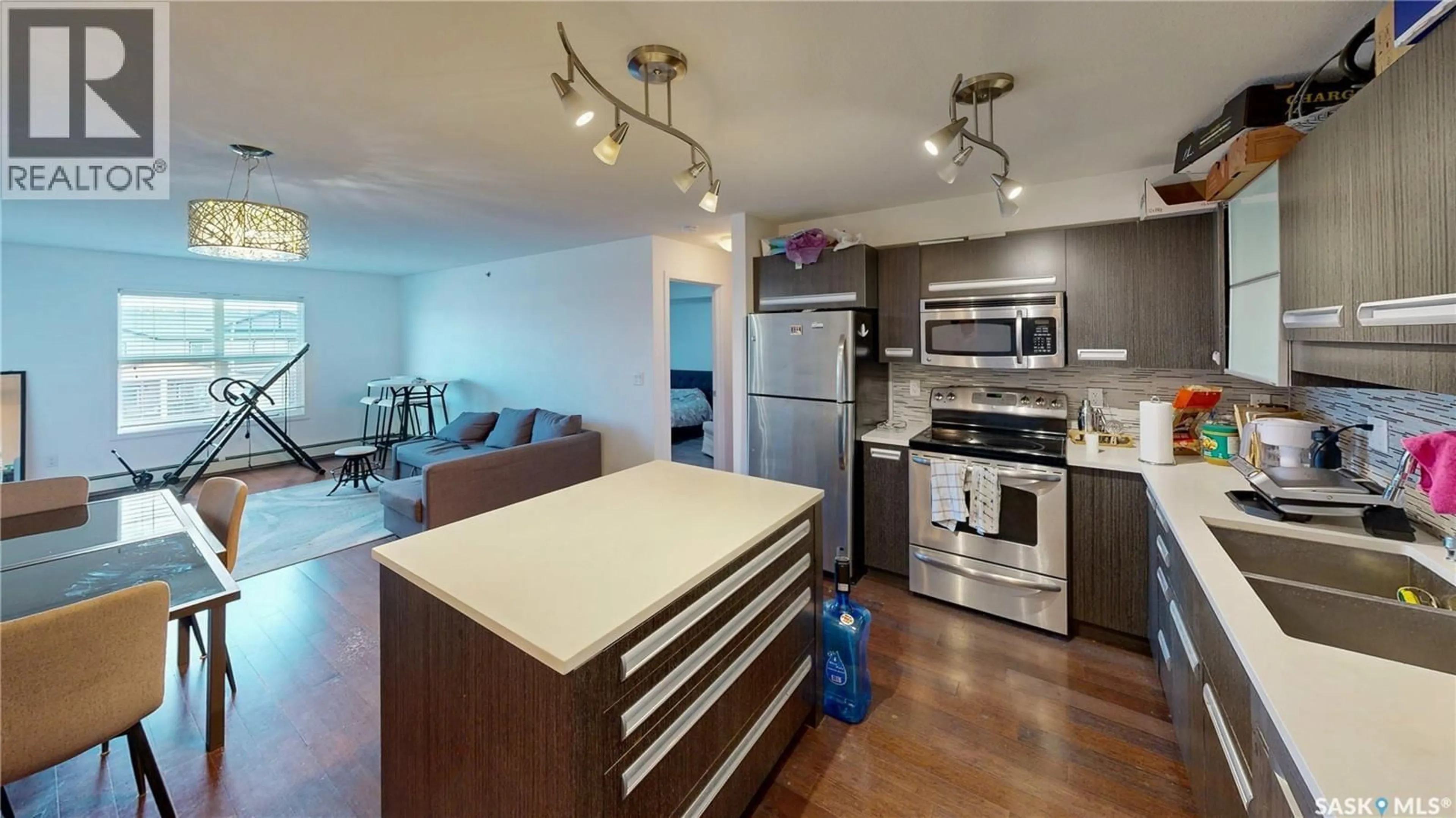 Open concept kitchen, wood/laminate floor for 305 - 1510 NEVILLE DRIVE, Regina Saskatchewan S4Z0A3