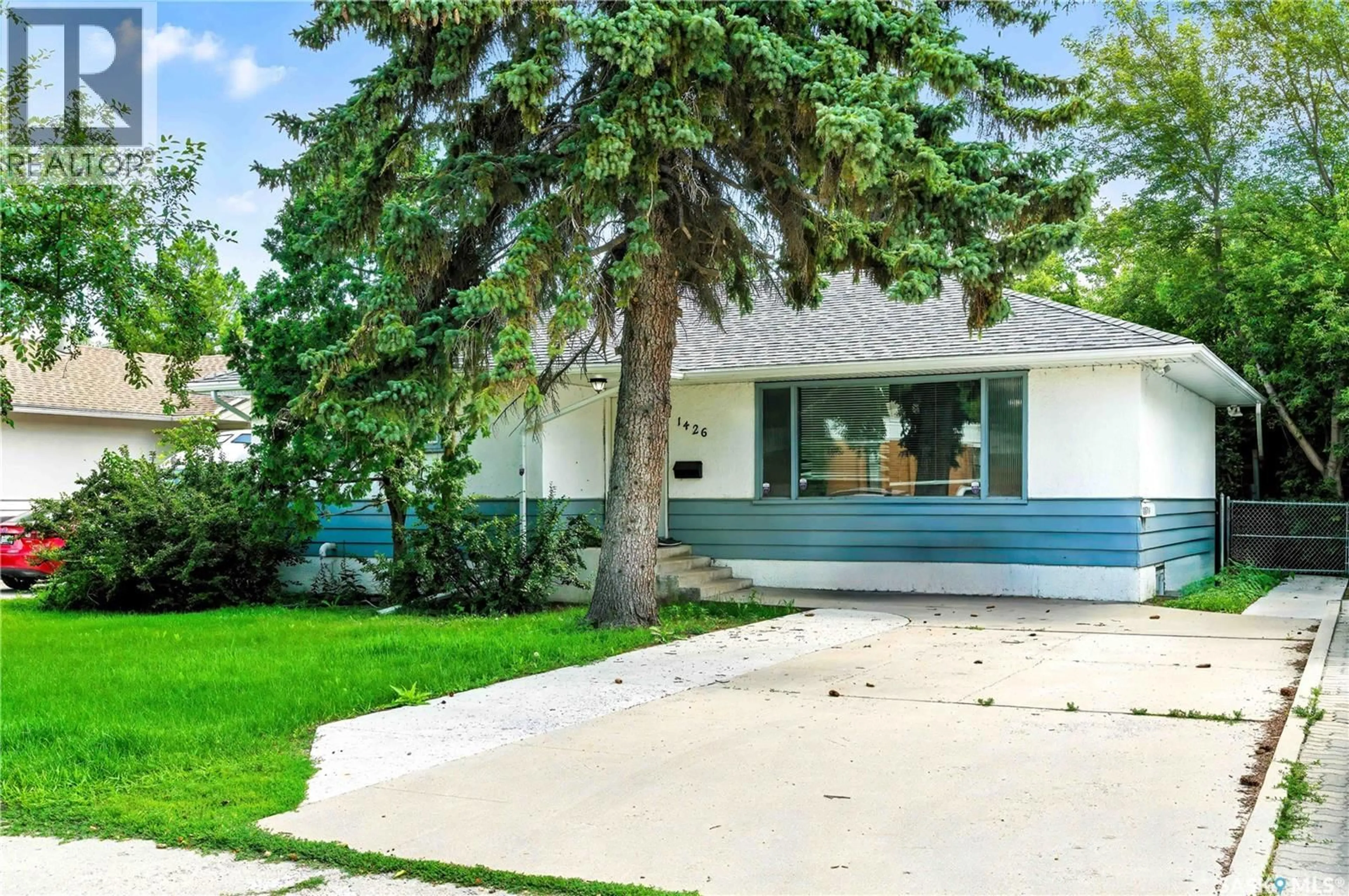 Home with vinyl exterior material, street for 1426 10TH STREET, Saskatoon Saskatchewan S7H0J5
