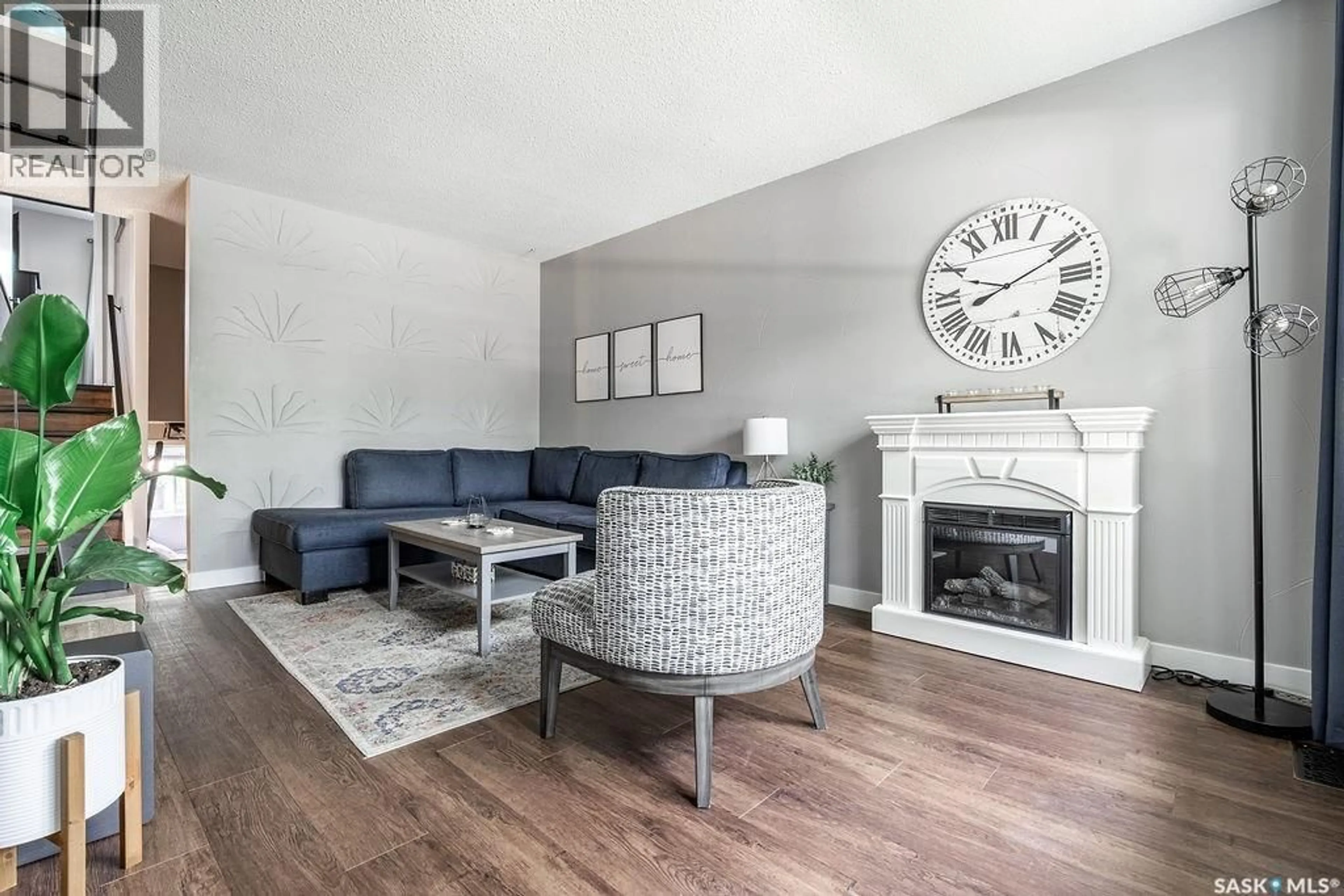 Living room with furniture, wood/laminate floor for 433 EAST PLACE, Saskatoon Saskatchewan S7J2Y7