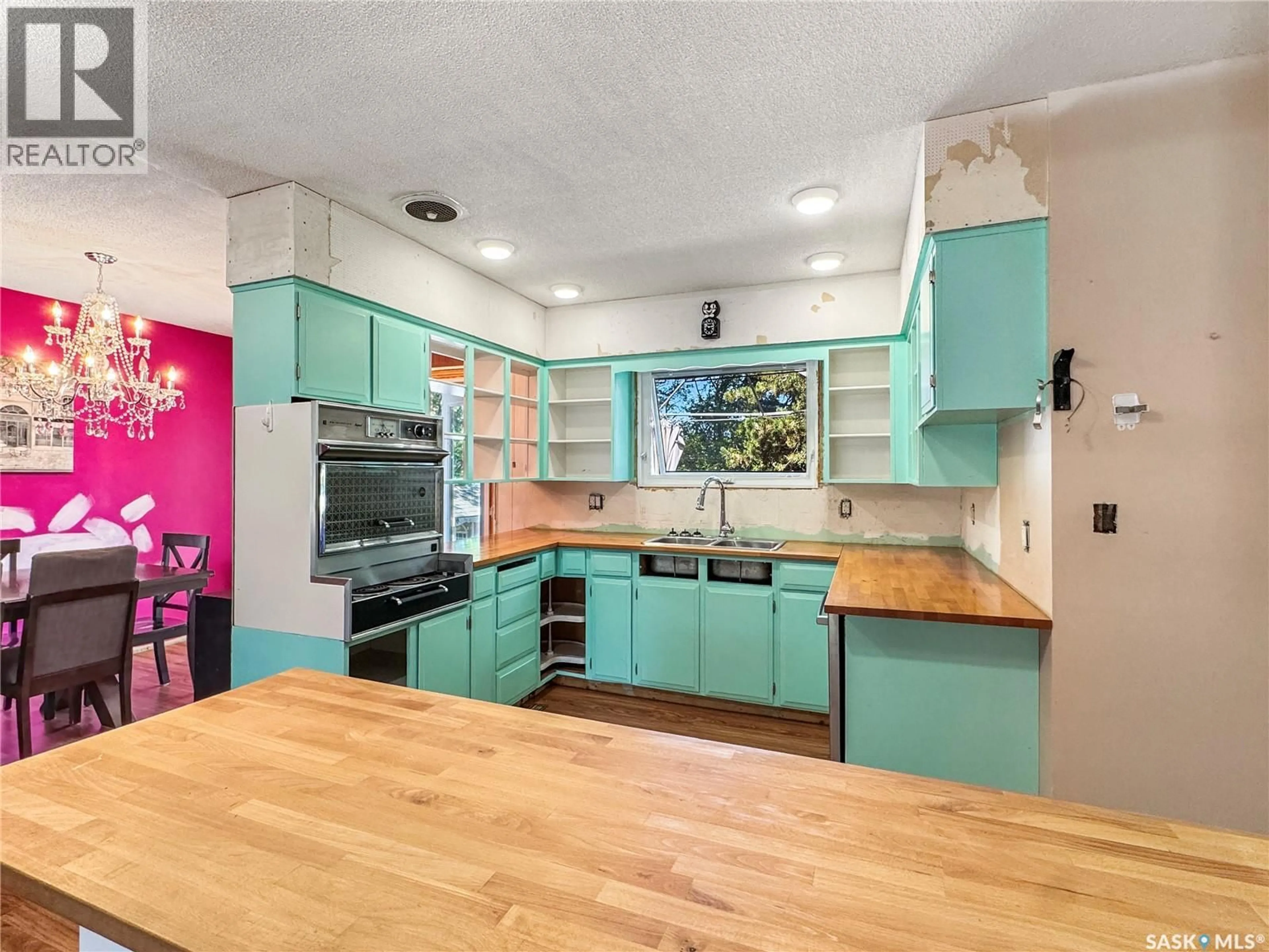 Open concept kitchen, wood/laminate floor for 111 DION AVENUE, Cut Knife Saskatchewan S0M0N0