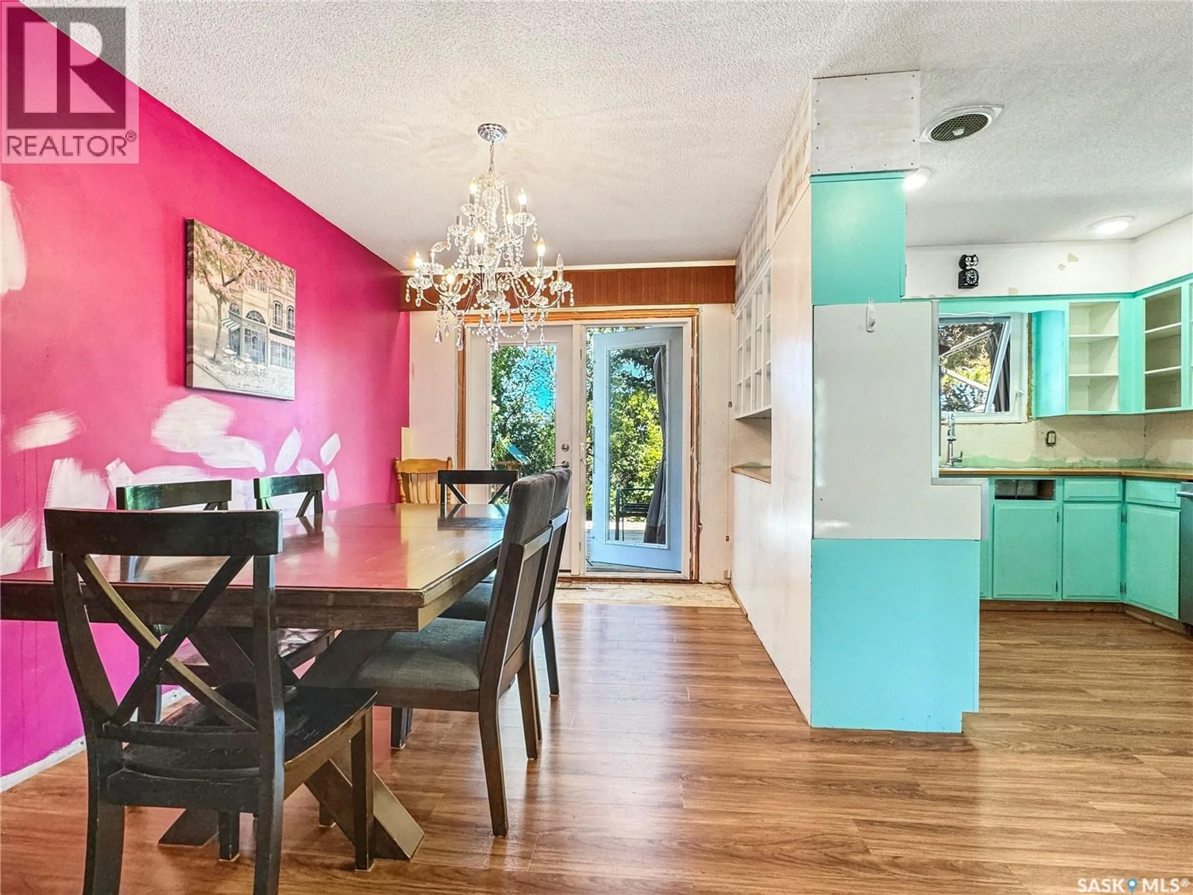 Dining room, wood/laminate floor for 111 DION AVENUE, Cut Knife Saskatchewan S0M0N0