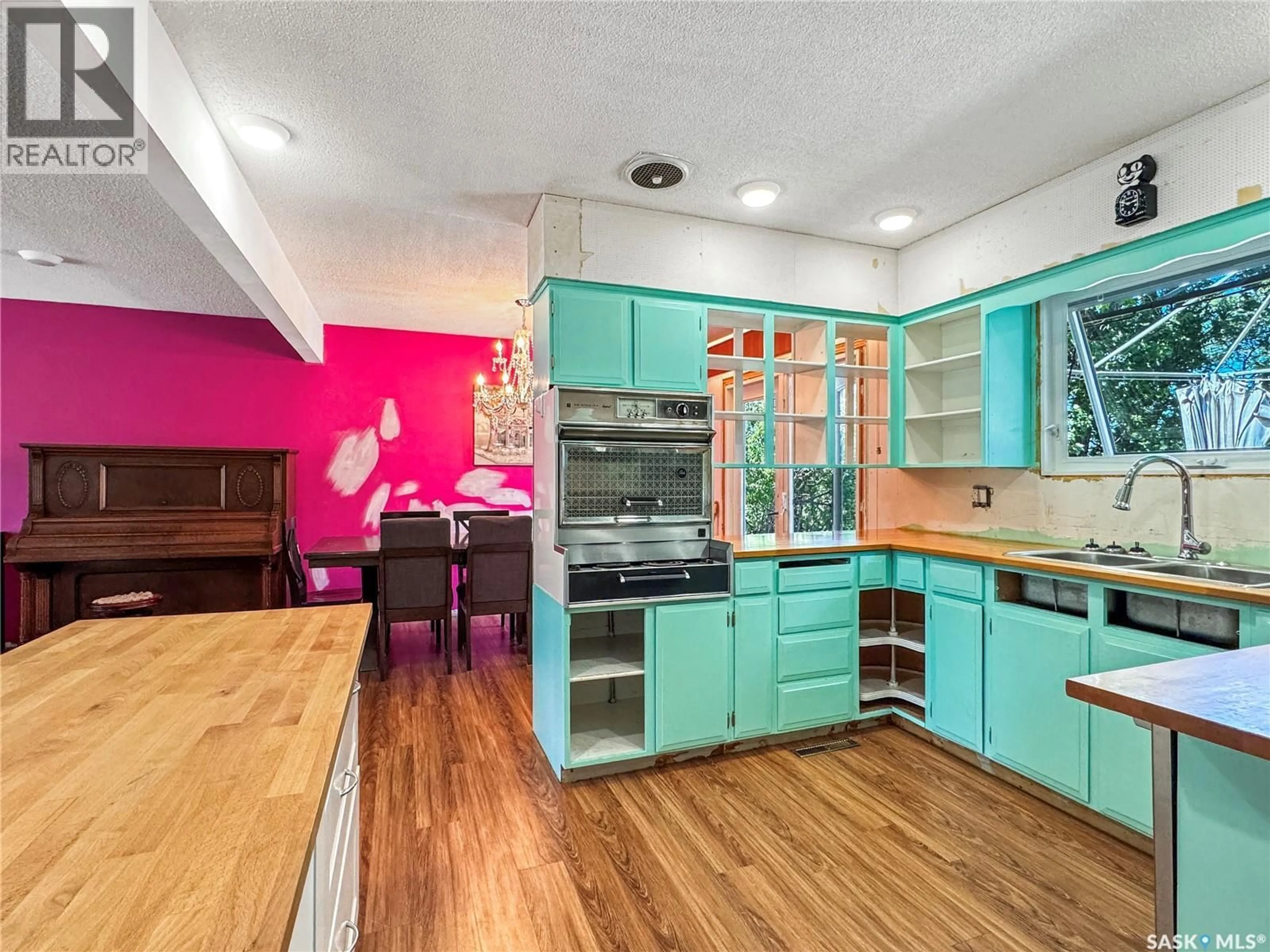 Open concept kitchen, wood/laminate floor for 111 DION AVENUE, Cut Knife Saskatchewan S0M0N0