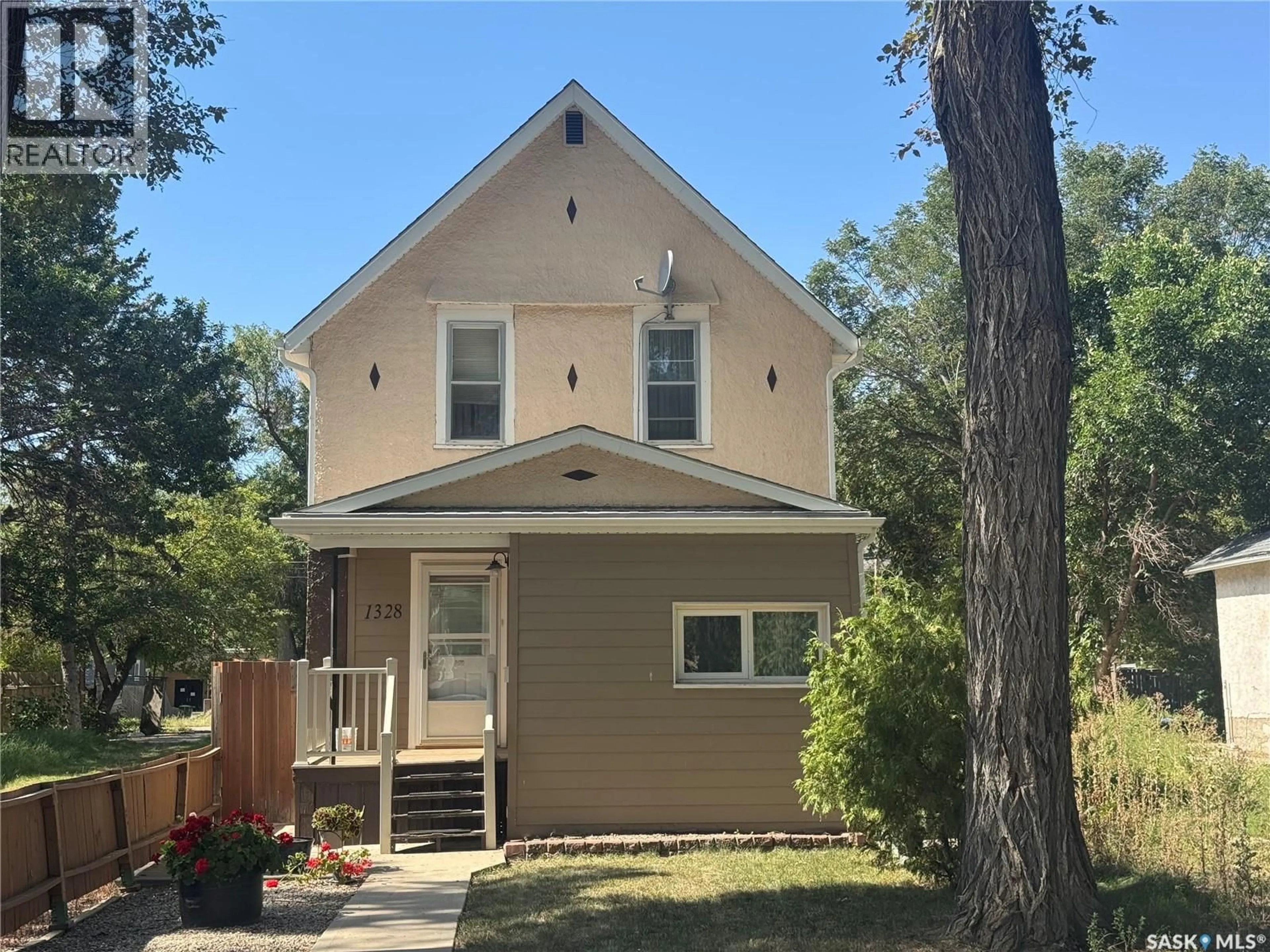 Home with vinyl exterior material, street for 1328 RETALLACK STREET, Regina Saskatchewan S4T2H9