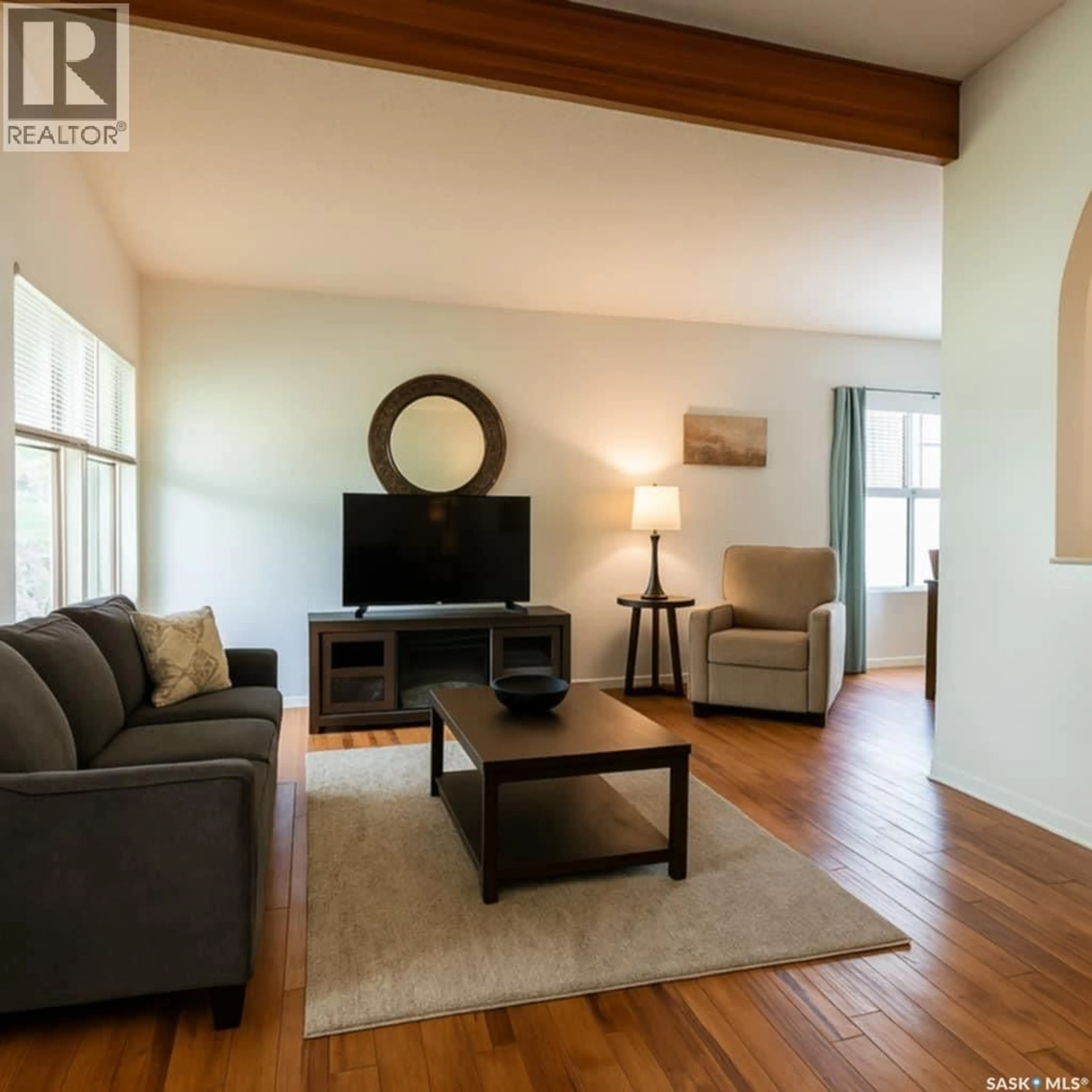 Living room with furniture, wood/laminate floor for 102 CAREY STREET, Regina Saskatchewan S4R4G9