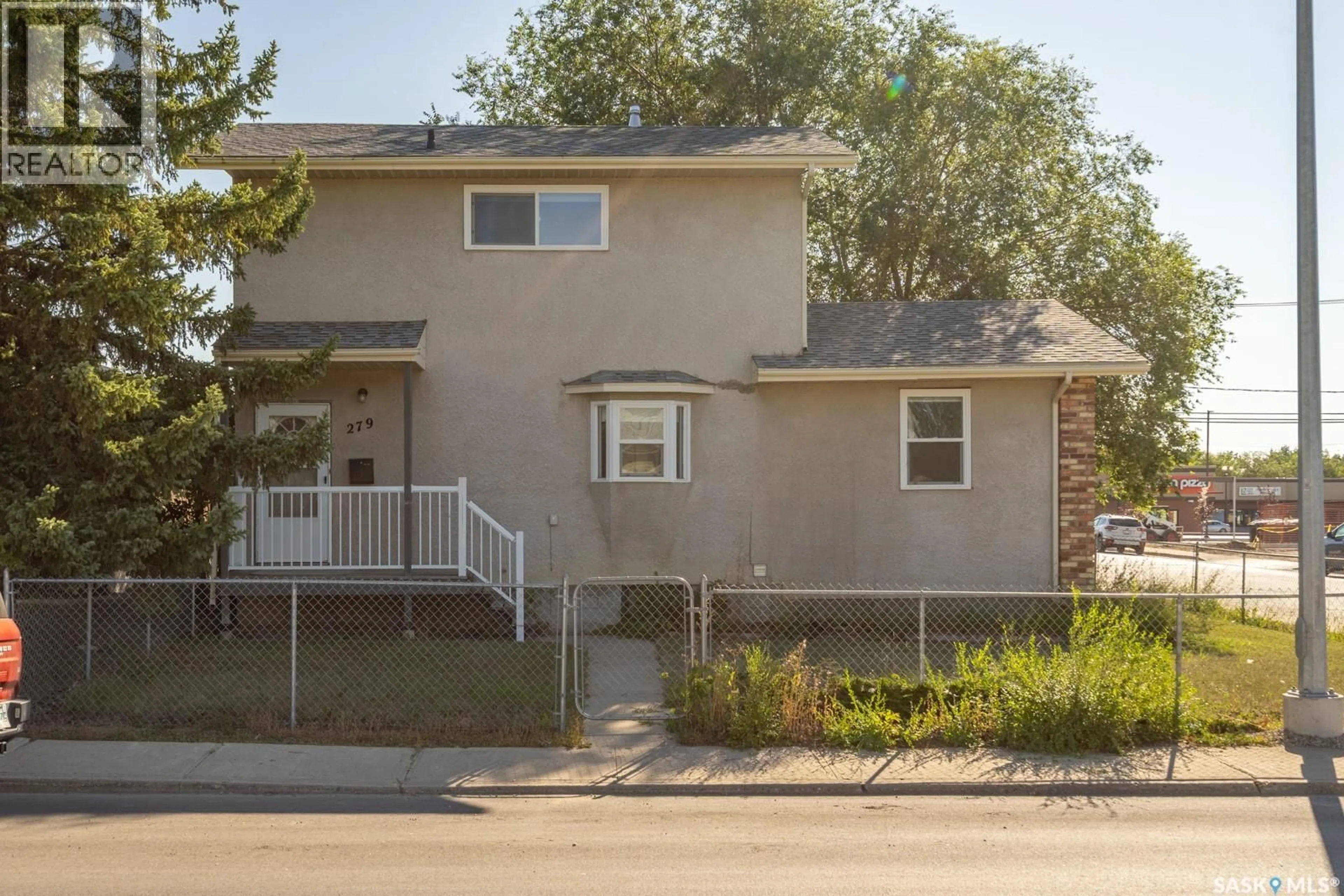 Home with vinyl exterior material, street for 279 ANGUS STREET, Regina Saskatchewan S4R3H4