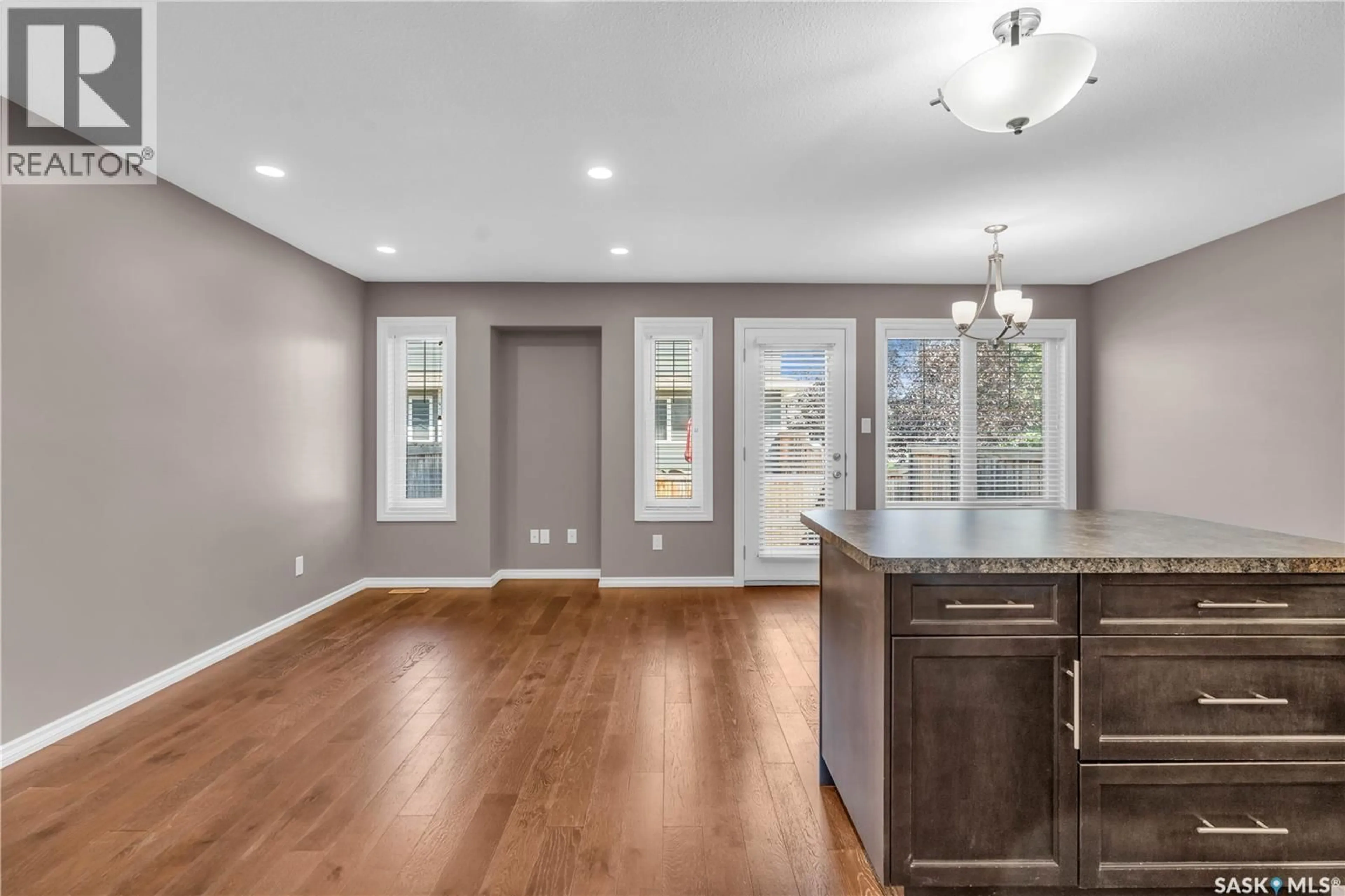 Open concept kitchen, wood/laminate floor for 103 - 4100 SANDHILL CRESCENT, Regina Saskatchewan S4V3G9