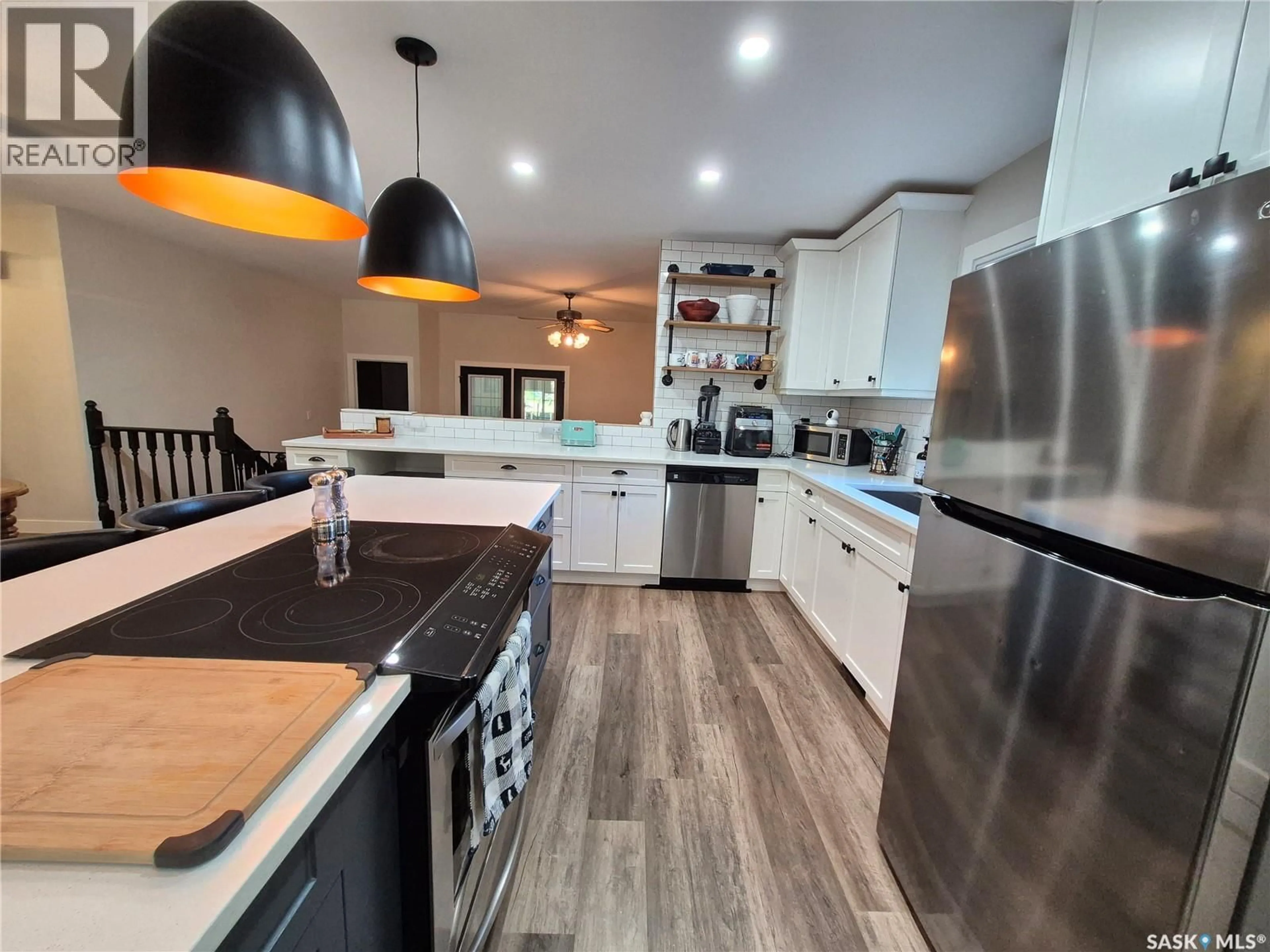 Open concept kitchen, wood/laminate floor for 502 HUNT STREET, Radville Saskatchewan S0C2G0