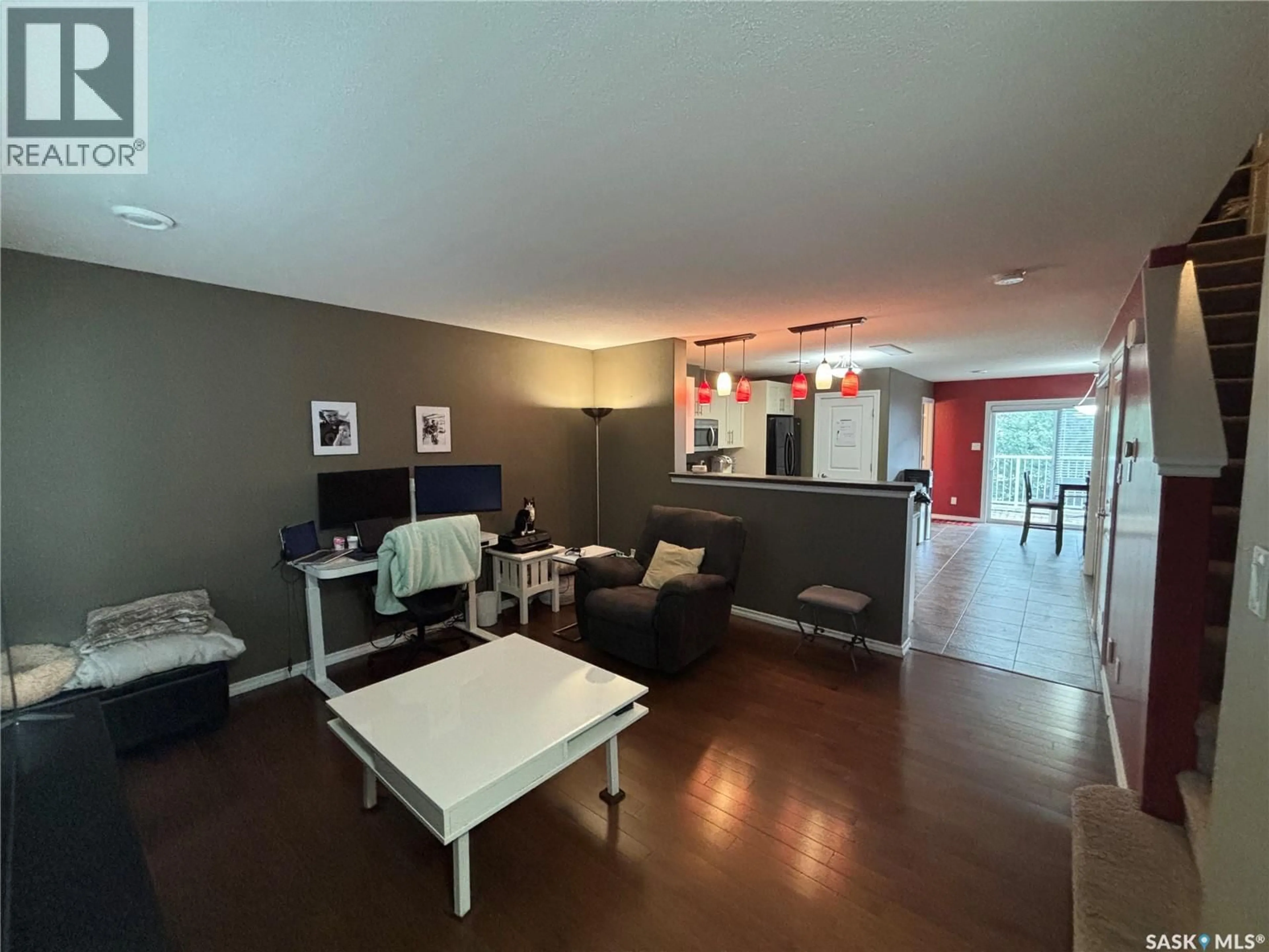 Living room with furniture, wood/laminate floor for 3 - 3225 WOODHAMS DRIVE, Regina Saskatchewan S4V3A2