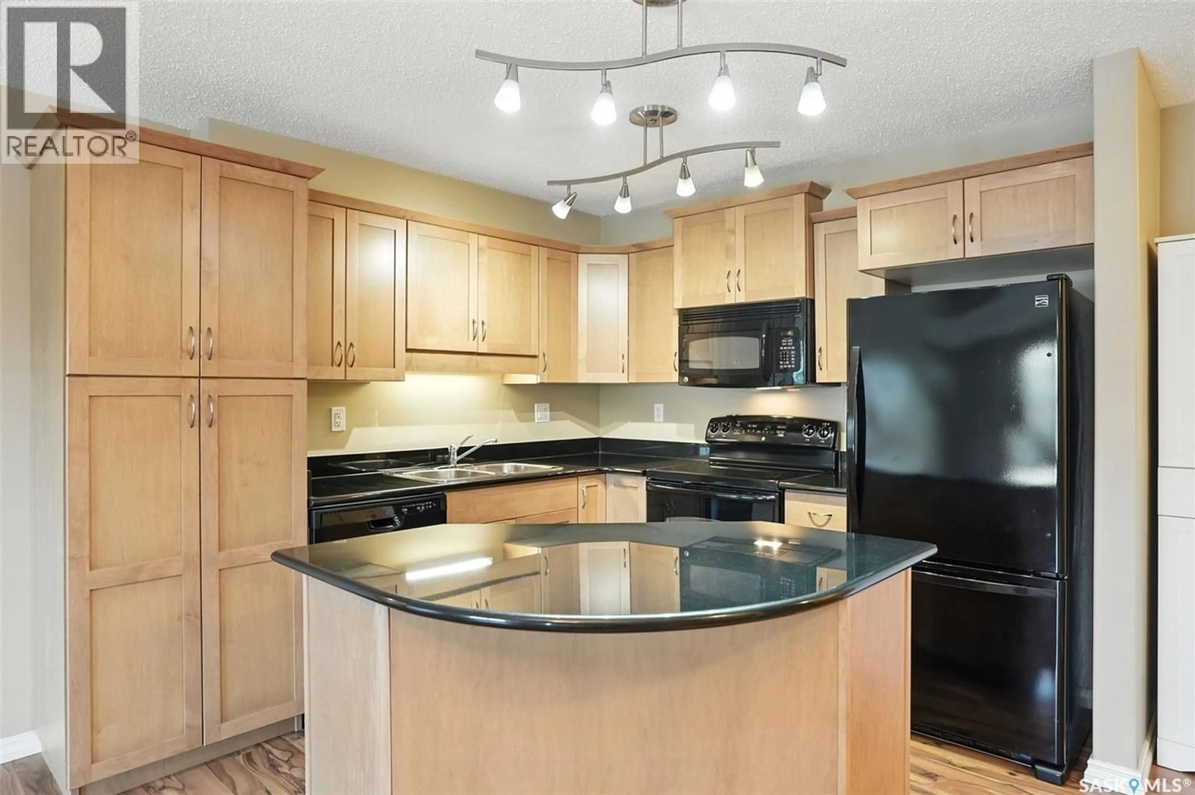 Open concept kitchen, ceramic/tile floor for 215B 103 WELLMAN CRESCENT, Saskatoon Saskatchewan S7T0C1