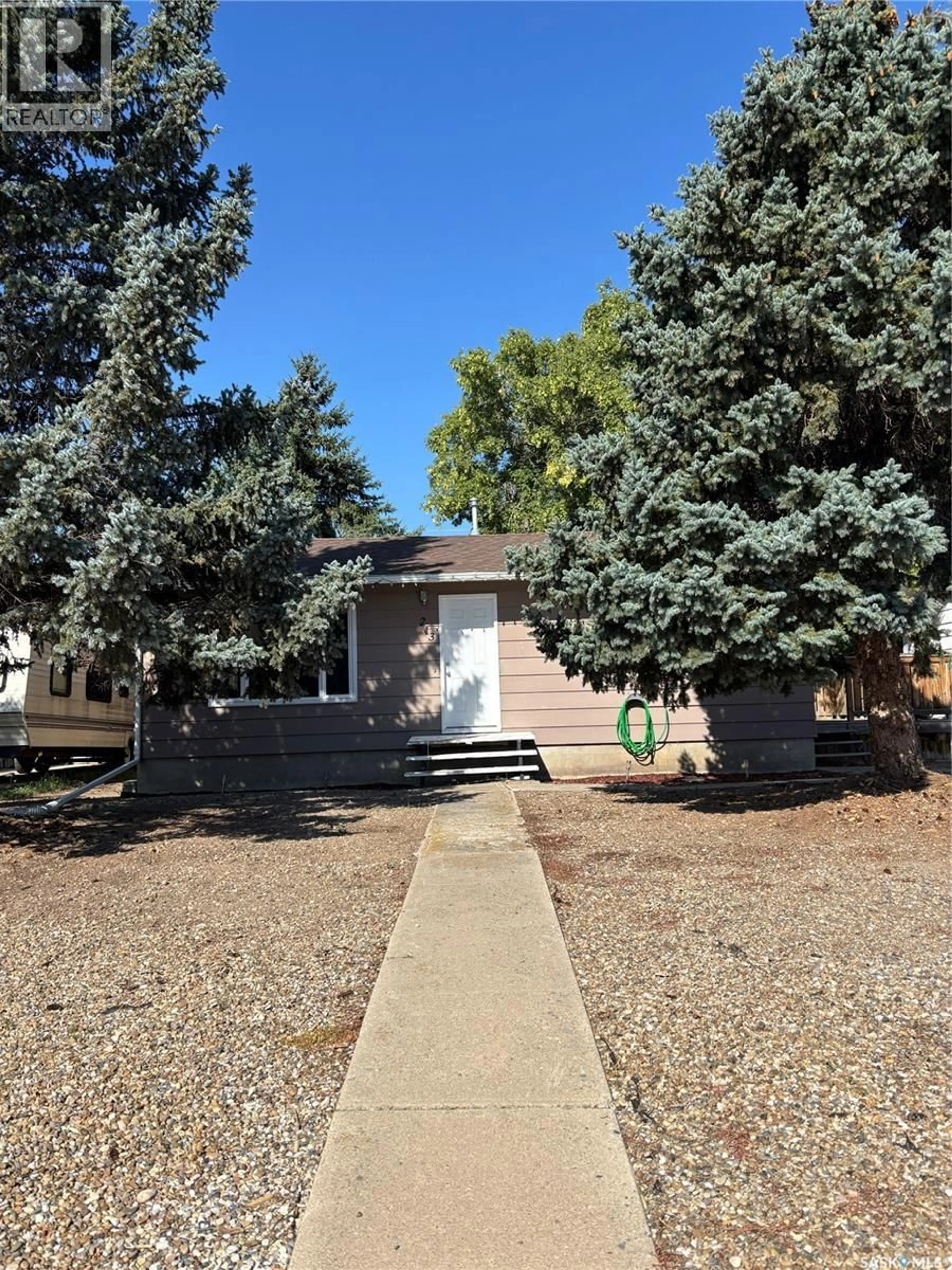 Home with vinyl exterior material, street for 213 GRIFFIN STREET, Maple Creek Saskatchewan S0N1N0
