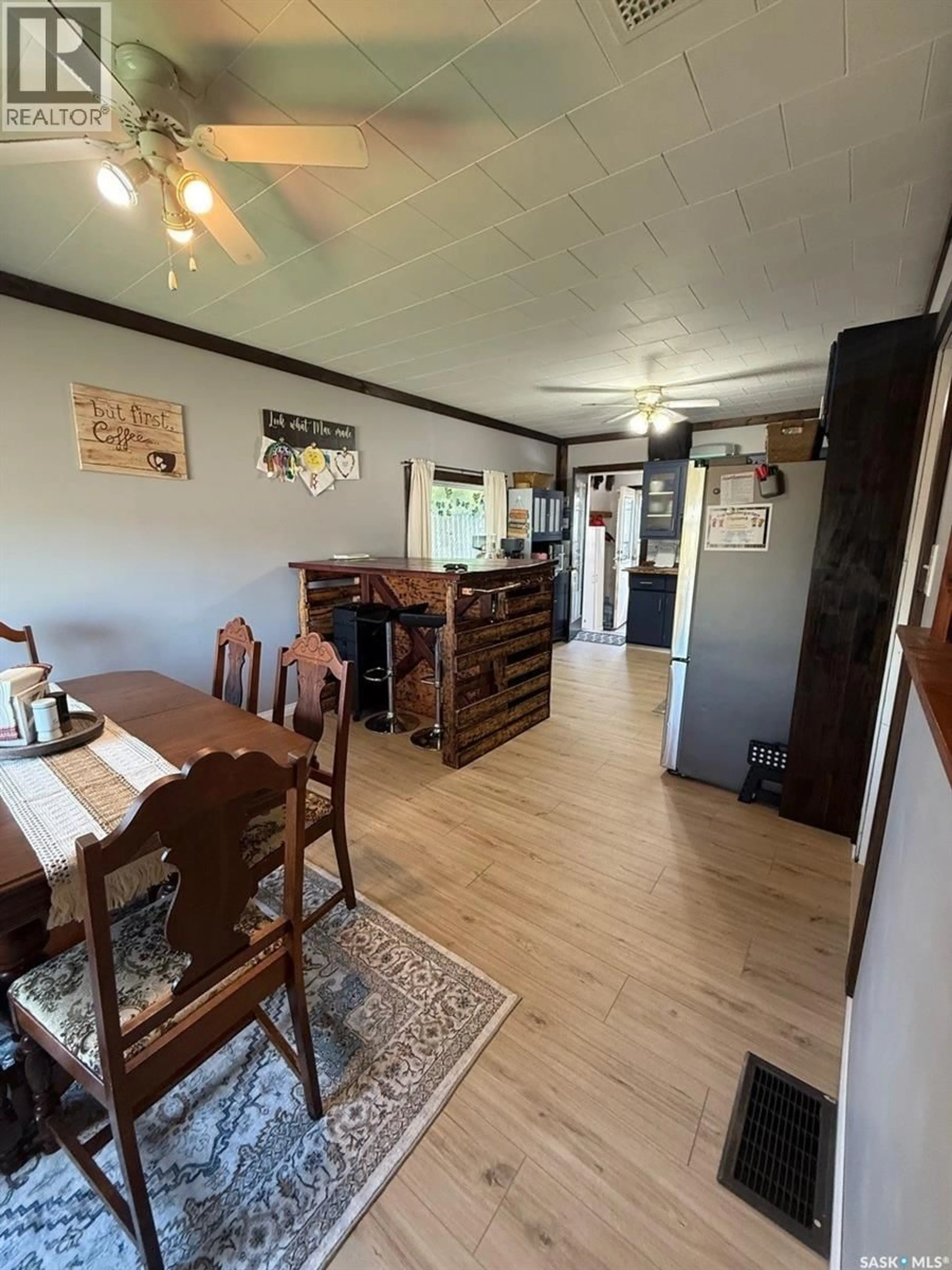 Dining room, wood/laminate floor for 931 111TH STREET, North Battleford Saskatchewan S9A2K2