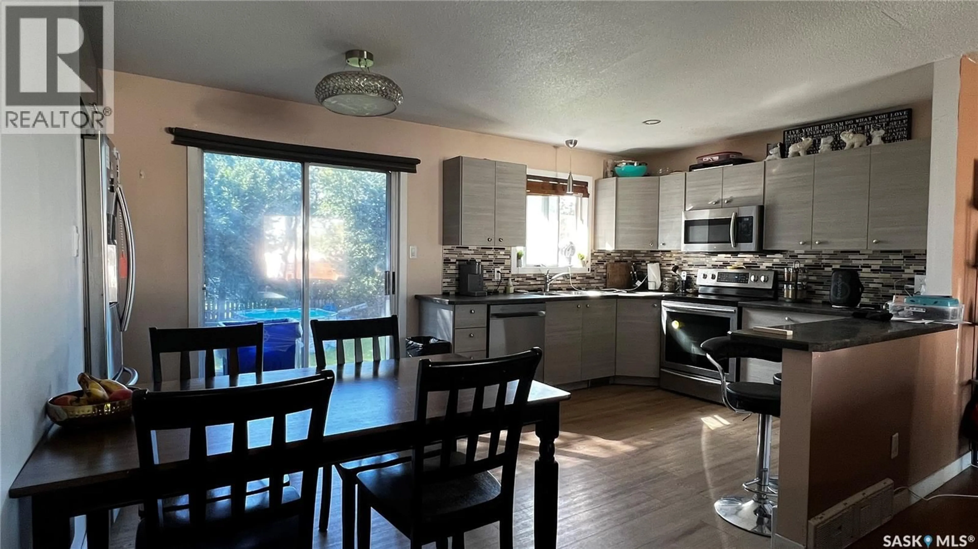 Open concept kitchen, wood/laminate floor for 435 BOWMAN CRESCENT, Saskatoon Saskatchewan S7L6P7