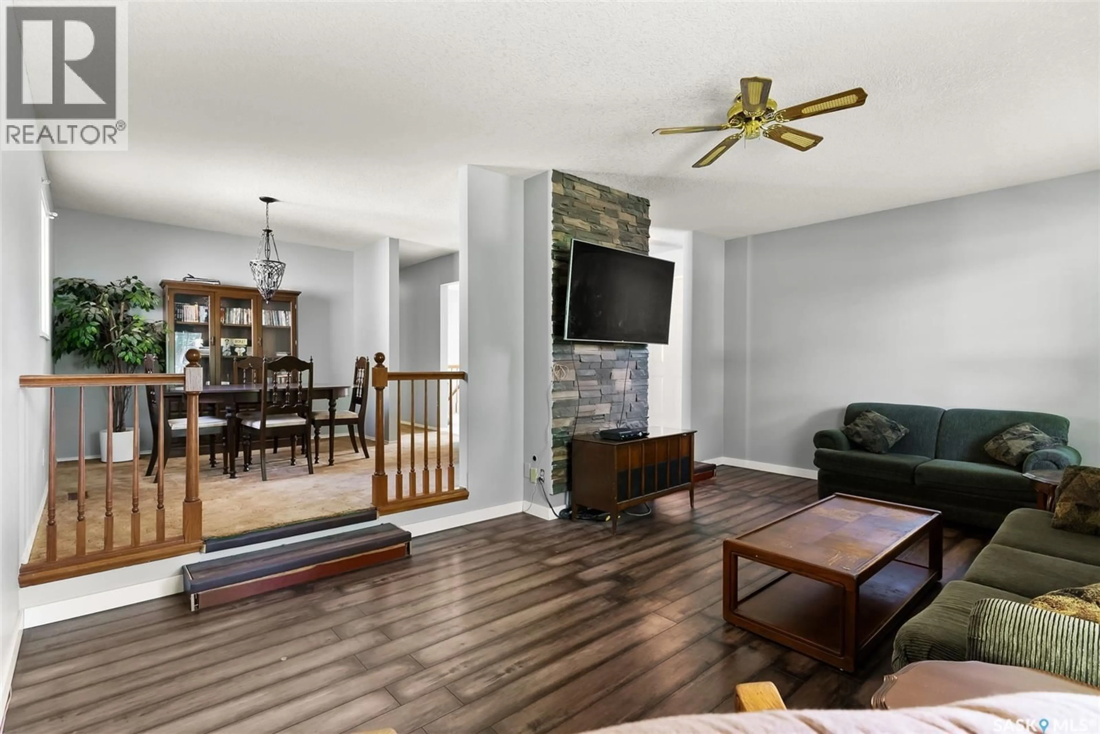 Living room with furniture, wood/laminate floor for 232 NAGEL CRESCENT, Regina Saskatchewan S4N4N5