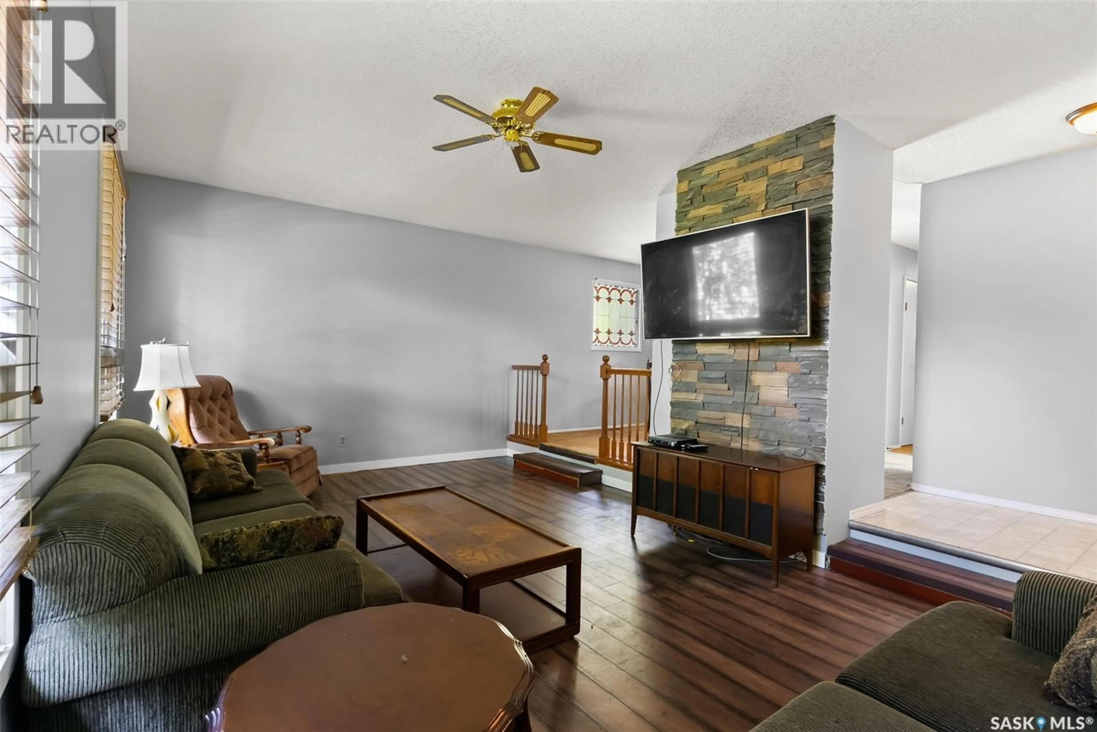 Living room with furniture, wood/laminate floor for 232 NAGEL CRESCENT, Regina Saskatchewan S4N4N5