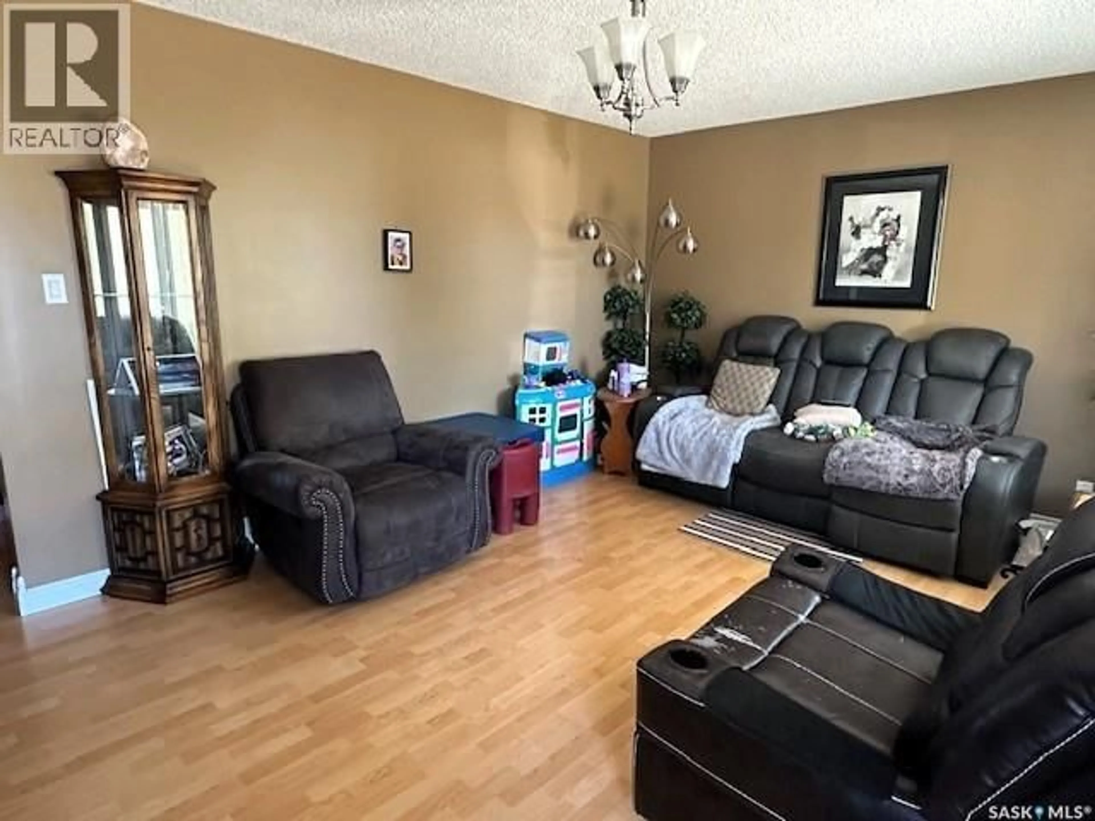Living room with furniture, unknown for 1121 MONTGOMERY STREET, Moose Jaw Saskatchewan S6H2X2