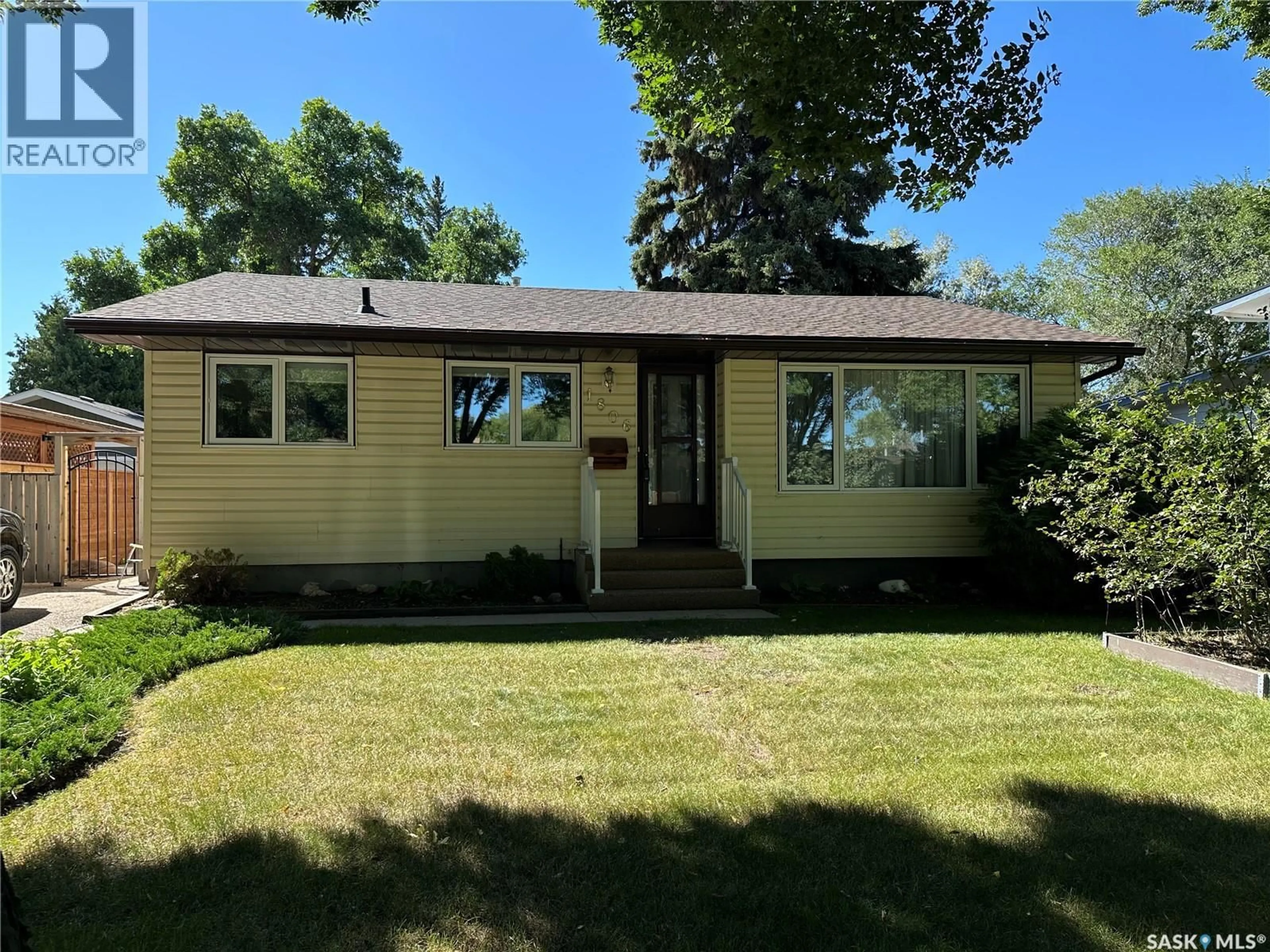 Home with vinyl exterior material, street for 1806 EASTHILL, Saskatoon Saskatchewan S7J3C1