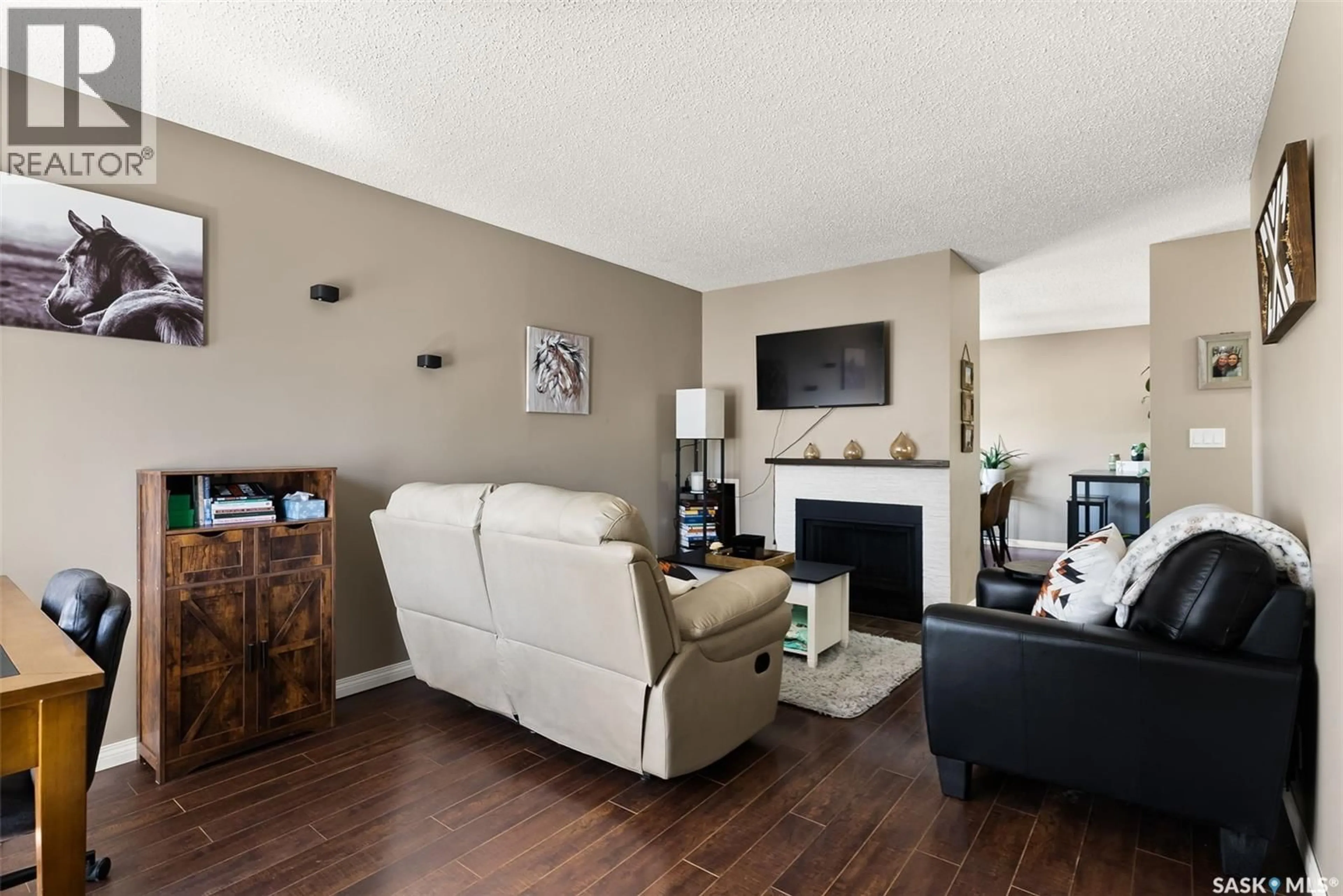 Living room with furniture, wood/laminate floor for 7323 DALGLIESH DRIVE, Regina Saskatchewan S4X2B8