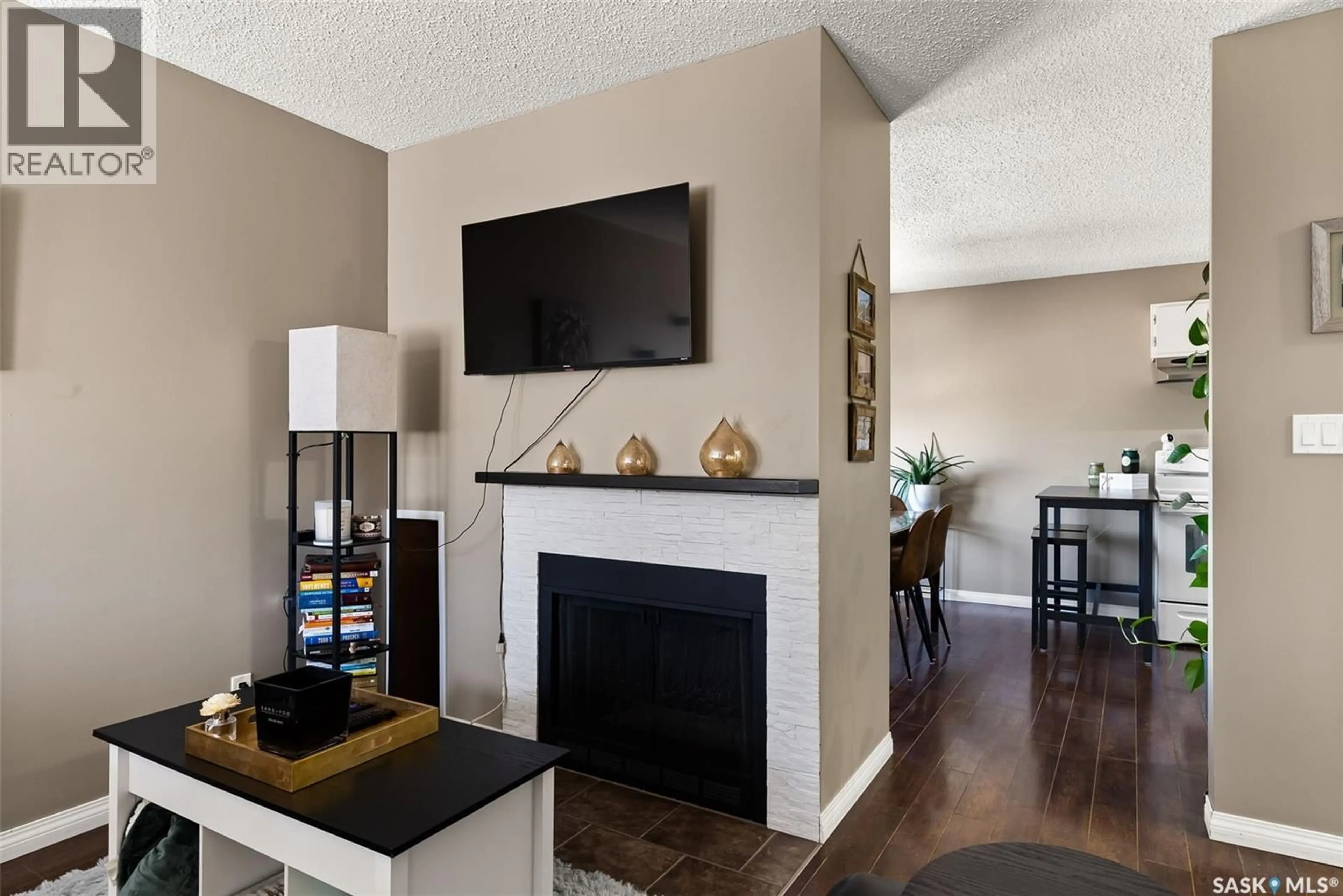 Living room with furniture, wood/laminate floor for 7323 DALGLIESH DRIVE, Regina Saskatchewan S4X2B8