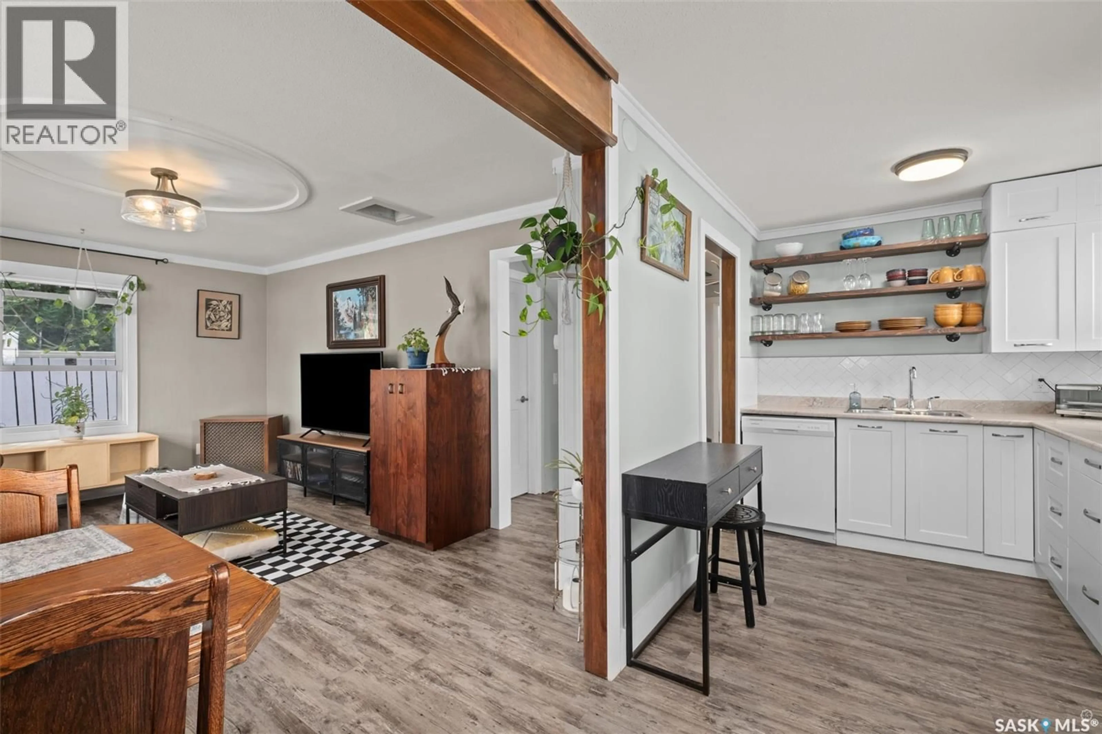 Living room with furniture, wood/laminate floor for 745 4TH STREET, Prince Albert Saskatchewan S6V0K4