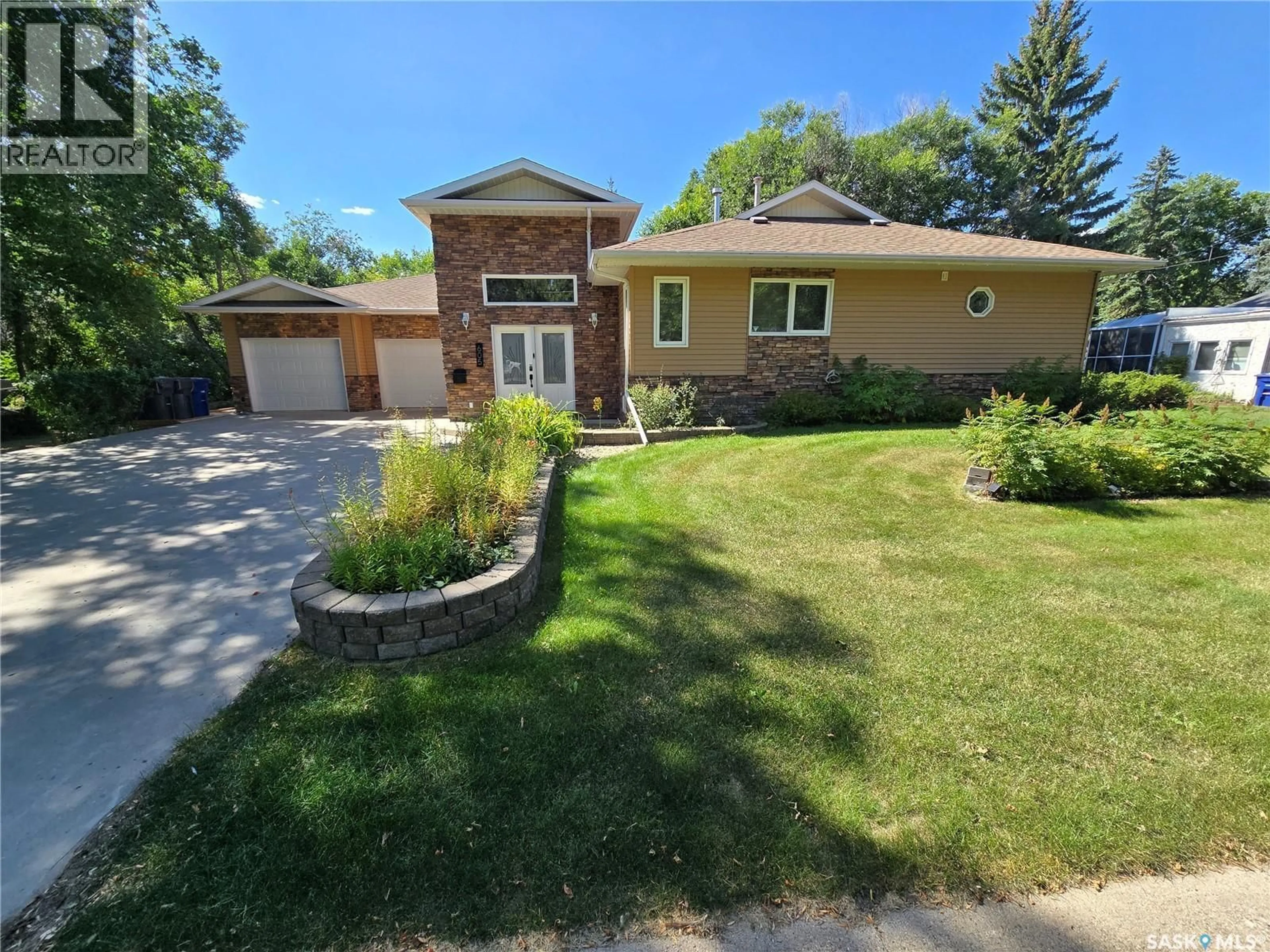 Home with brick exterior material, street for 605 ELGIN STREET, Weyburn Saskatchewan S4H0B9