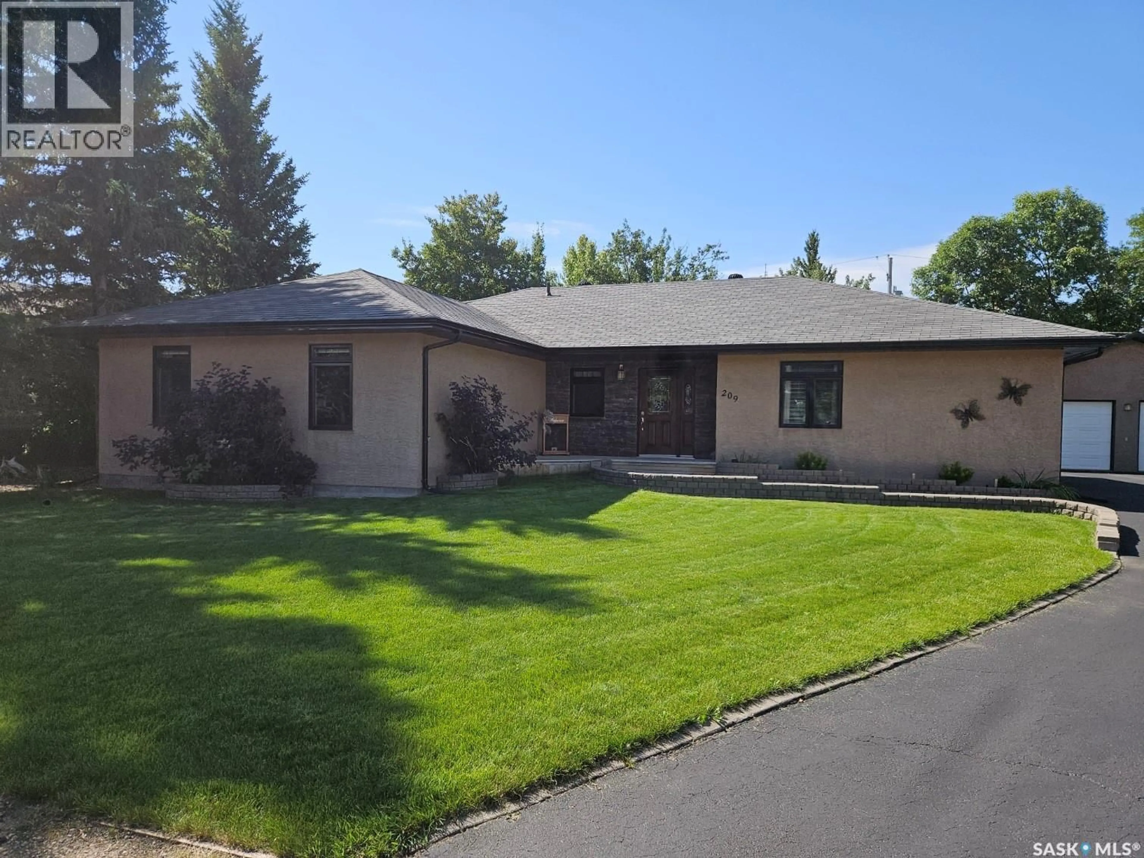 Home with vinyl exterior material, street for 209 PARK STREET, Leroy Saskatchewan S0K2P0