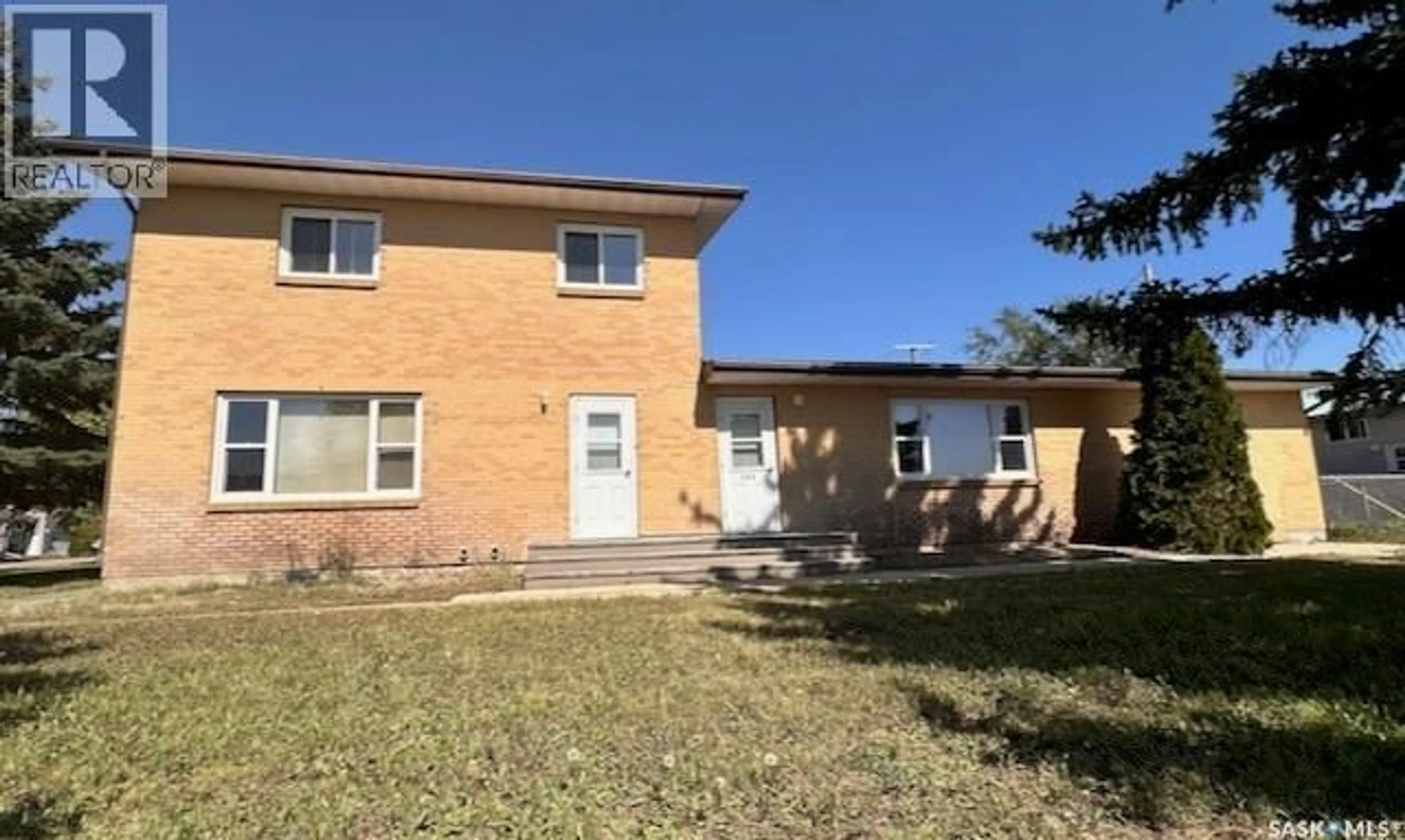 Home with brick exterior material, street for 209 3RD AVENUE, Kyle Saskatchewan S0L1T0