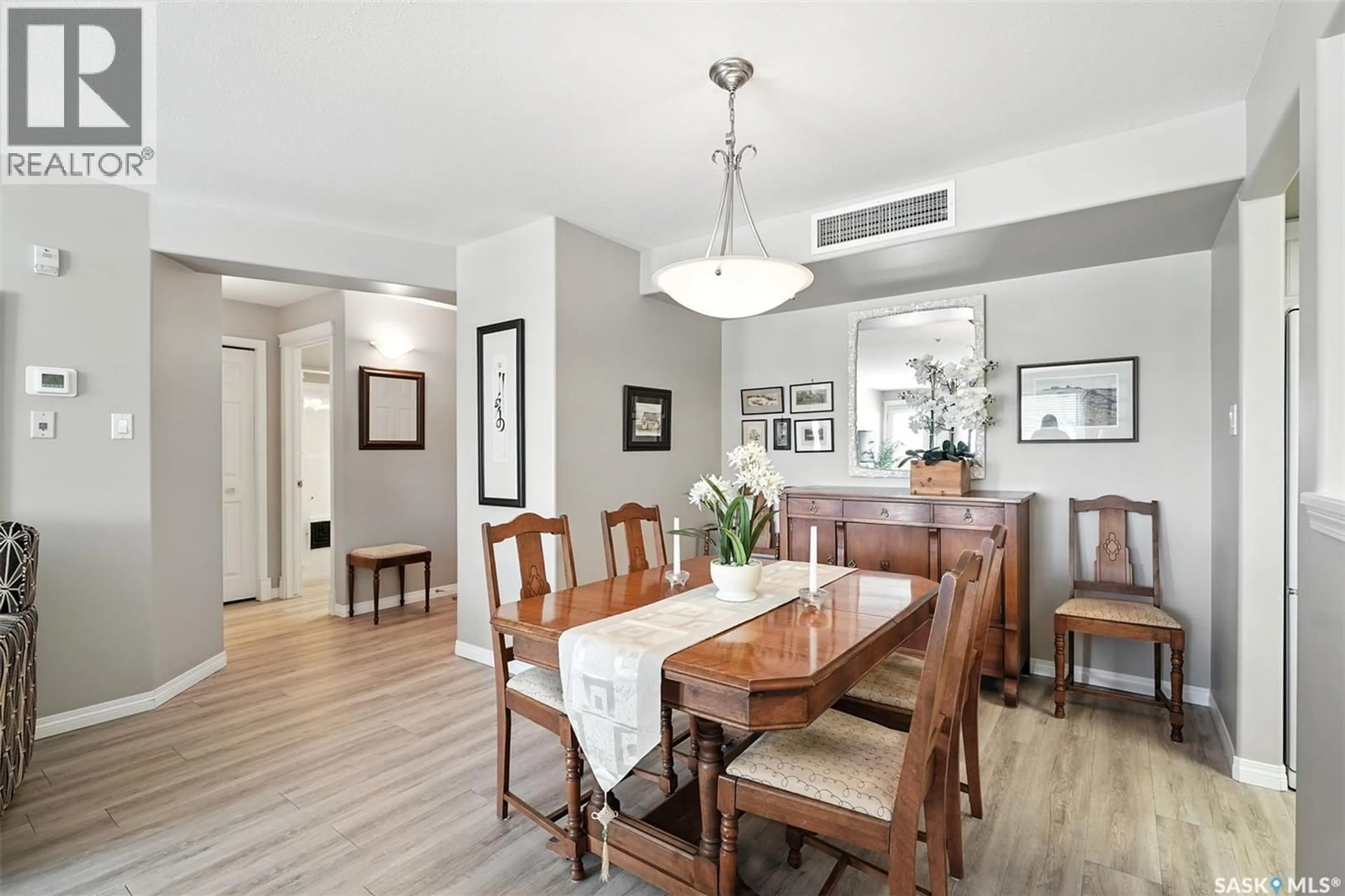 Dining room, wood/laminate floor for 210 - 1850 MAIN STREET, Saskatoon Saskatchewan S7H5T2