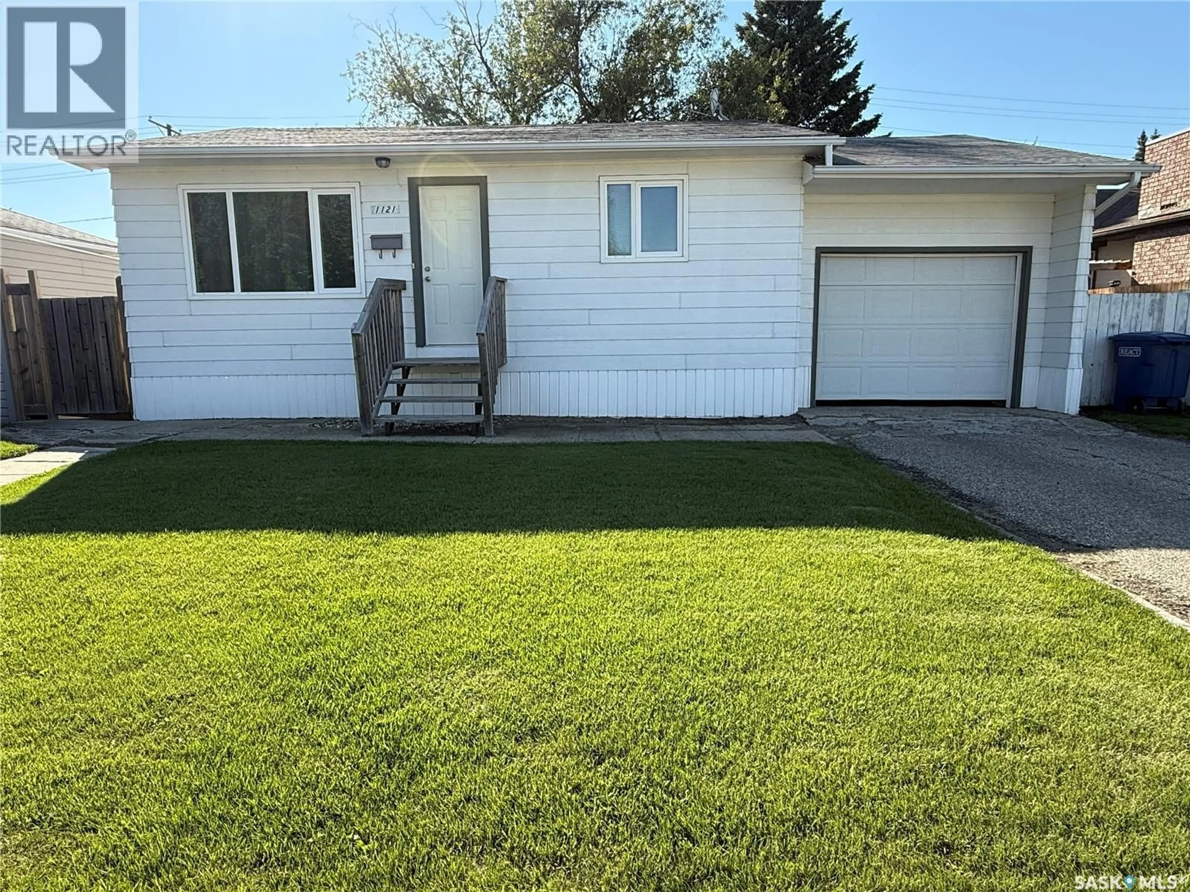 Home with vinyl exterior material, street for 1121 9TH STREET, Humboldt Saskatchewan S0K2A0