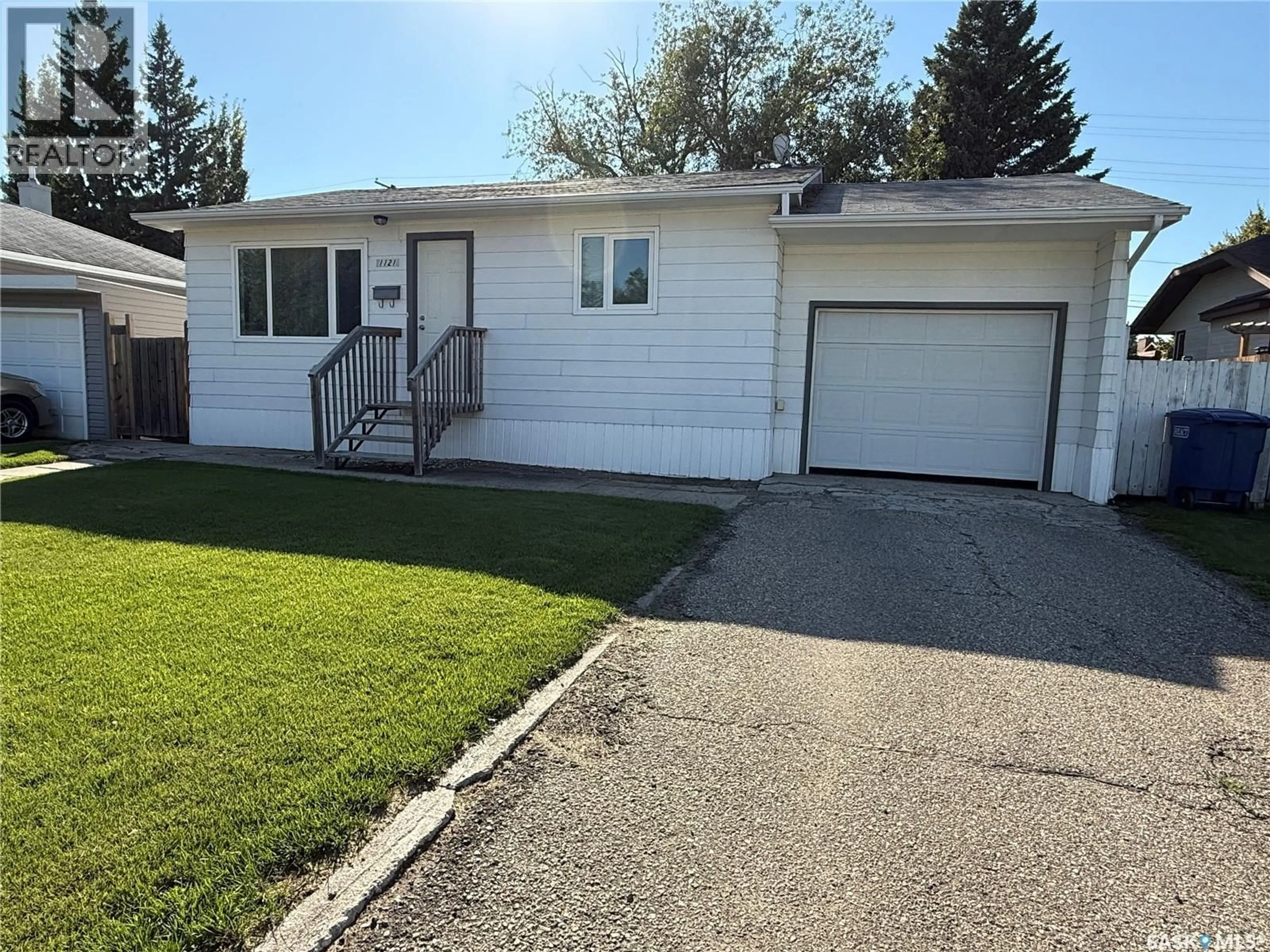 Home with vinyl exterior material, street for 1121 9TH STREET, Humboldt Saskatchewan S0K2A0