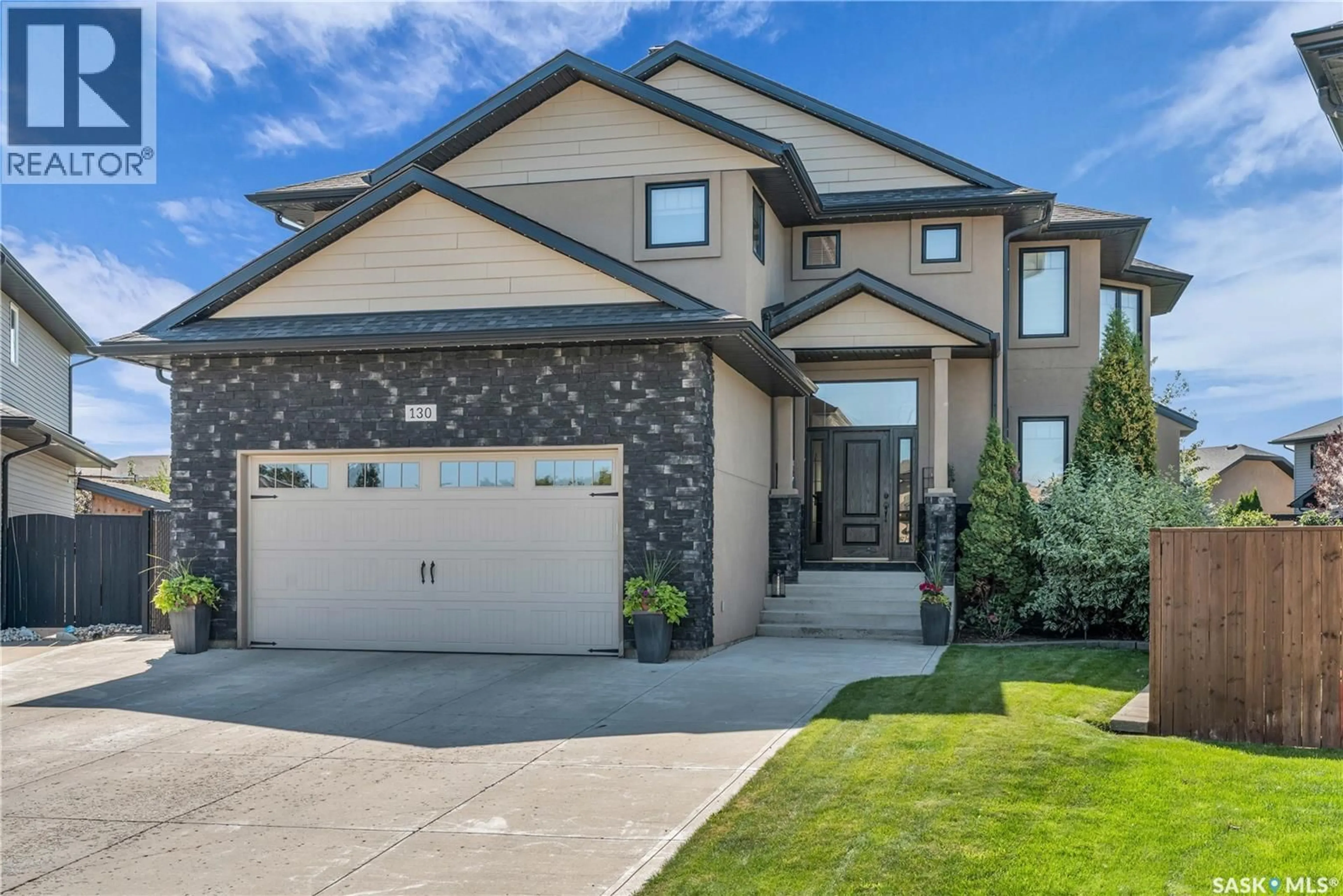Home with vinyl exterior material, street for 130 SKUCE PLACE, Saskatoon Saskatchewan S7M0G8