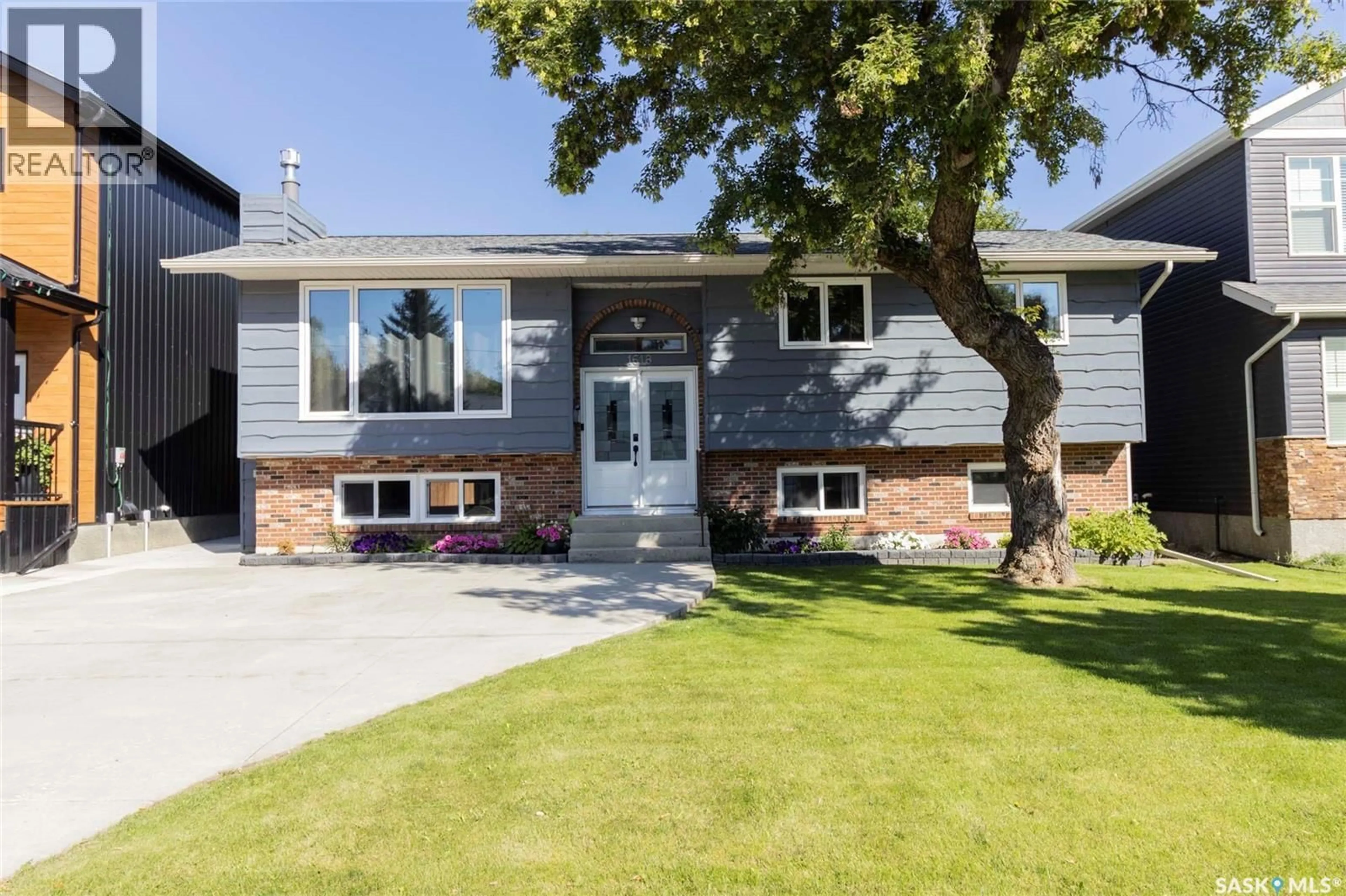 Home with vinyl exterior material, street for 1618 ALEXANDRA AVENUE, Saskatoon Saskatchewan S7K3C3