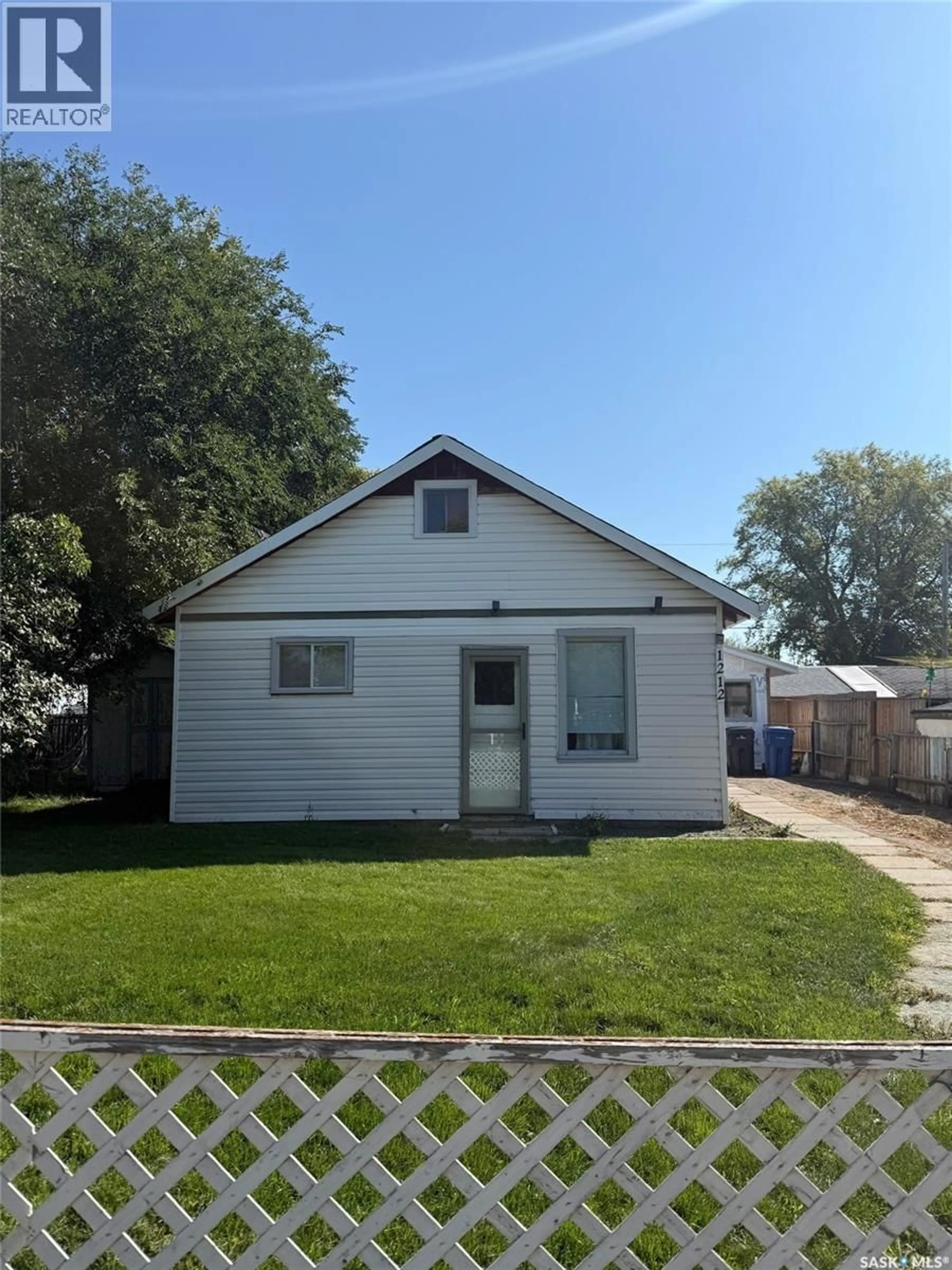 Home with vinyl exterior material, street for 1212 108TH STREET, North Battleford Saskatchewan S9A2B2